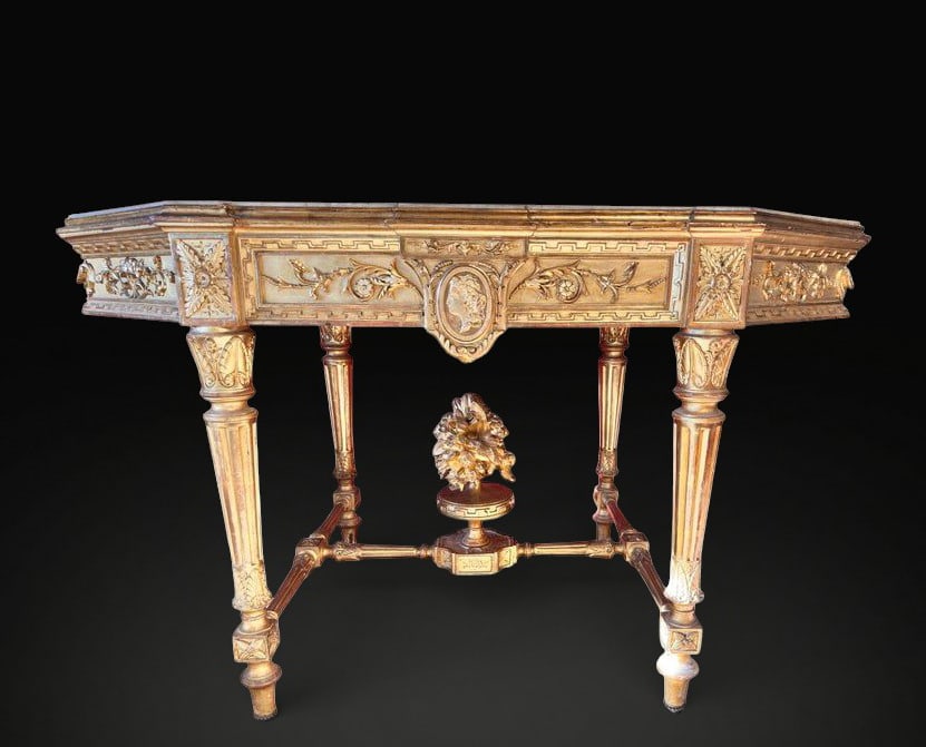 Napoleon III Giltwood Console Table with Marble Top, French School, 19th Century: Carved and gilt wood, marble. Measurements 74 cm high x 122 cm wide x 68 cm deep. Elegant console table conceived as a refined decorative and functional element, characterized by a richly carved giltw