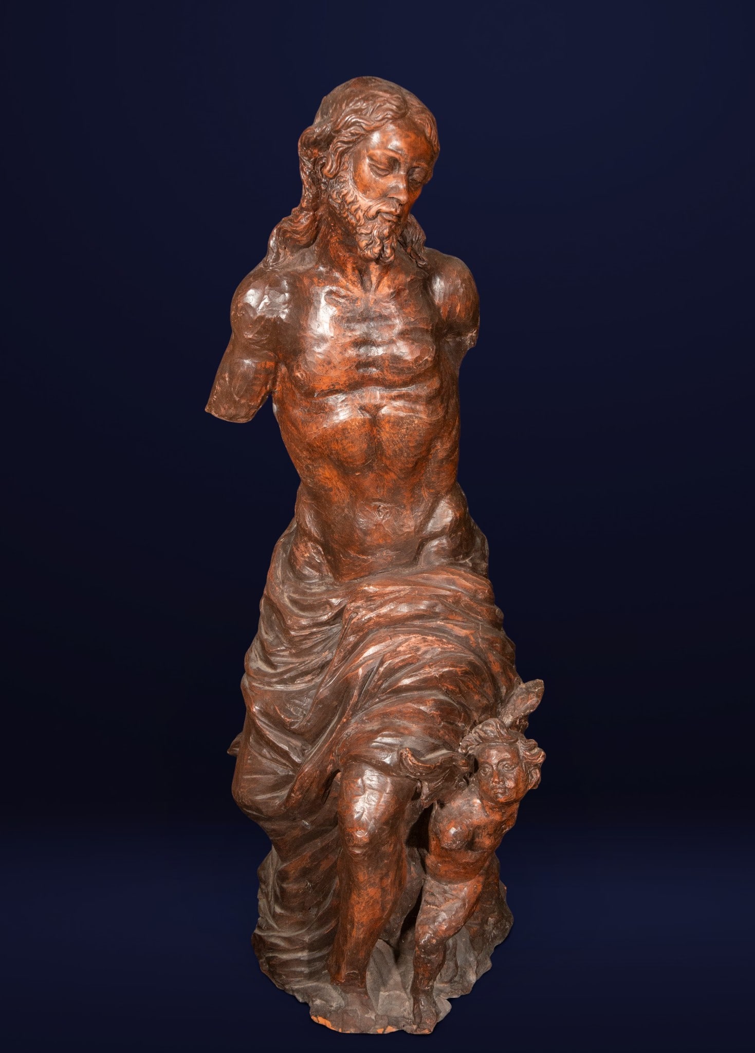 Christ tied to the column, Baroque school, 17th century: High-quality terracotta sculpture. Depiction of Christ, semi-nude and bound, accompanied by a small angel in a comforting pose. The defined anatomy and meticulous study of muscles demonstrate outstand