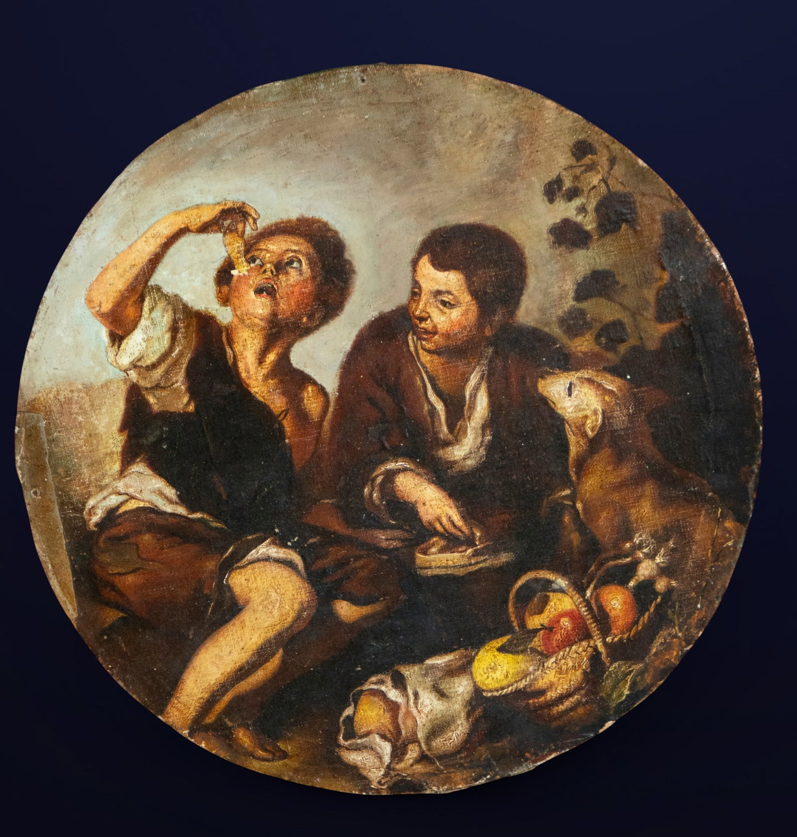 According to Murillo - 18th or 19th centuries: Canvas mounted on panel. A genre scene of great narrative spontaneity depicting two boys sharing an everyday moment with a dog and a basket of fruit in a barely suggested rural setting. One of the boy