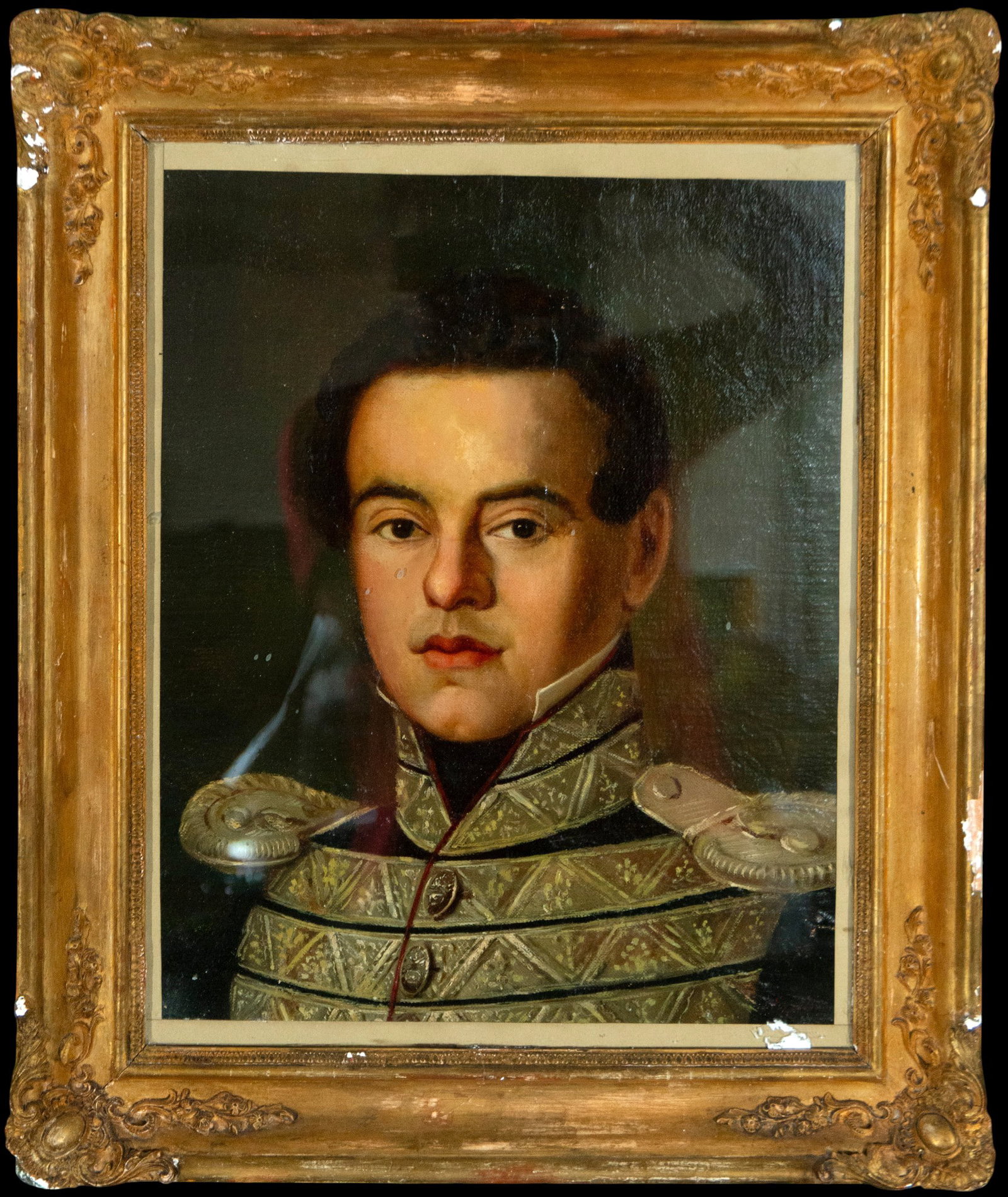 Portrait of a young soldier, European School, 19th Century: Oil on canvas. Bust portrait of a young officer in full military dress uniform decorated with gold embroidery and metal epaulettes, executed with remarkable academic precision. The subject gazes at th
