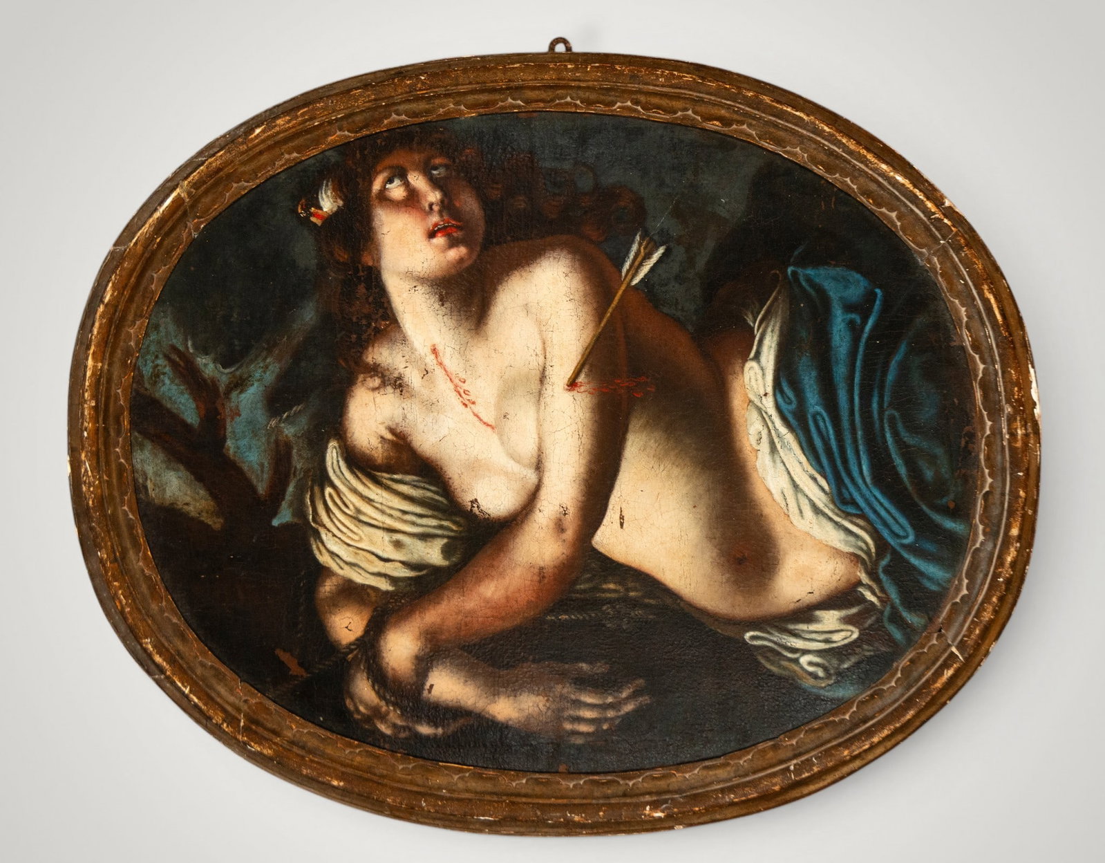THE MARTYRDOM OF SAINT PHILOMENA - 17TH CENTURY ITALIAN BAROQUE MASTER: Oil on canvas. Dimensions 69 × 89 cm and 81 × 100 cm. Saint Sebastian appears semi-nude after being pierced by the arrows of his martyrdom, his gaze directed towards heaven and enveloped in dramatic