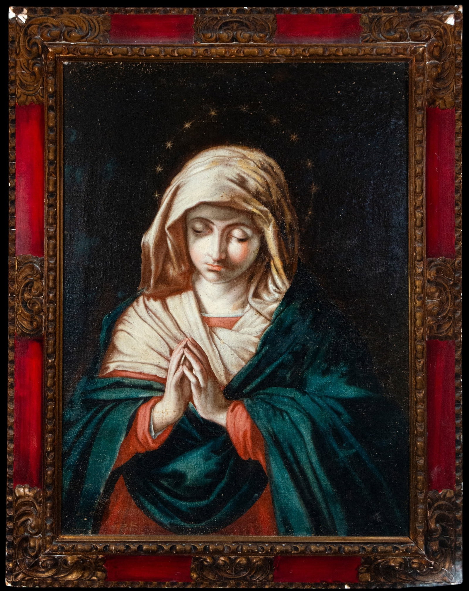 Praying Virgin. Italian School. 17th Century: Oil on canvas. Dimensions without frame: 83 x 62 cm. Dimensions with frame: 100 x 78 cm. The Virgin is depicted half-length, with her hands clasped and her gaze lowered, surrounded by a discreet crown
