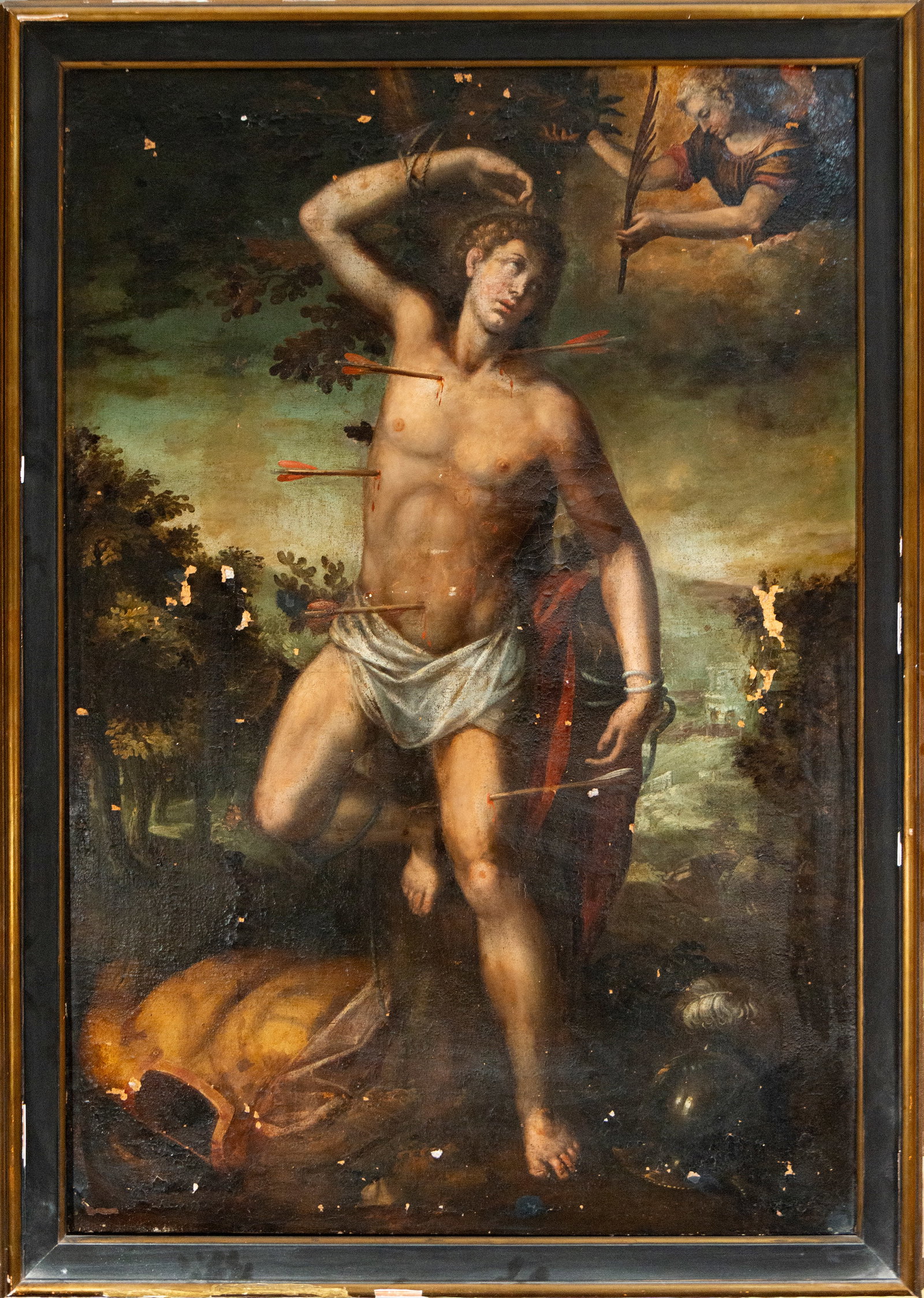 Martyrdom of Saint Sebastian – Bolognese Master. Italian School of the 17th Century: Oil on canvas. Dimensions of the work: 128 × 88 cm; with frame: 143 × 101 cm. Saint Sebastian appears semi-nude and tied to a tree, pierced by numerous arrows. In the upper right, an angel holds the