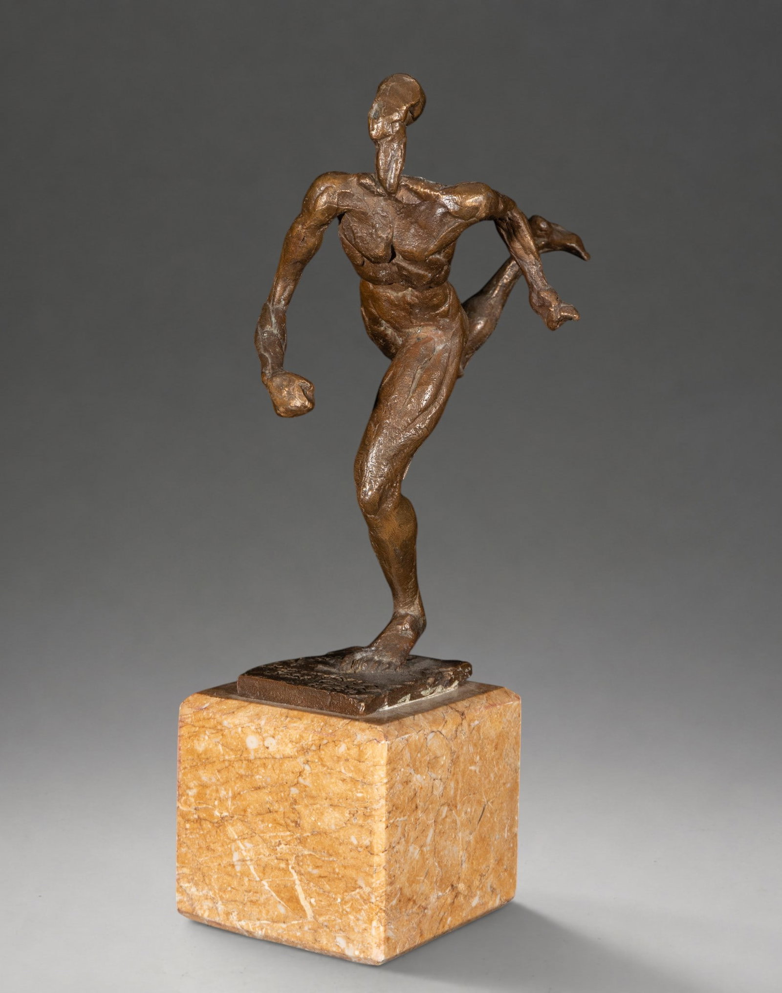 Runner, signed José Cano – 20th century: Brutalist bronze sculpture depicting a runner in motion, with deliberately stylized anatomy and a rough, modeled surface. The figure stands on one leg, accentuating the sense of speed and physical ten