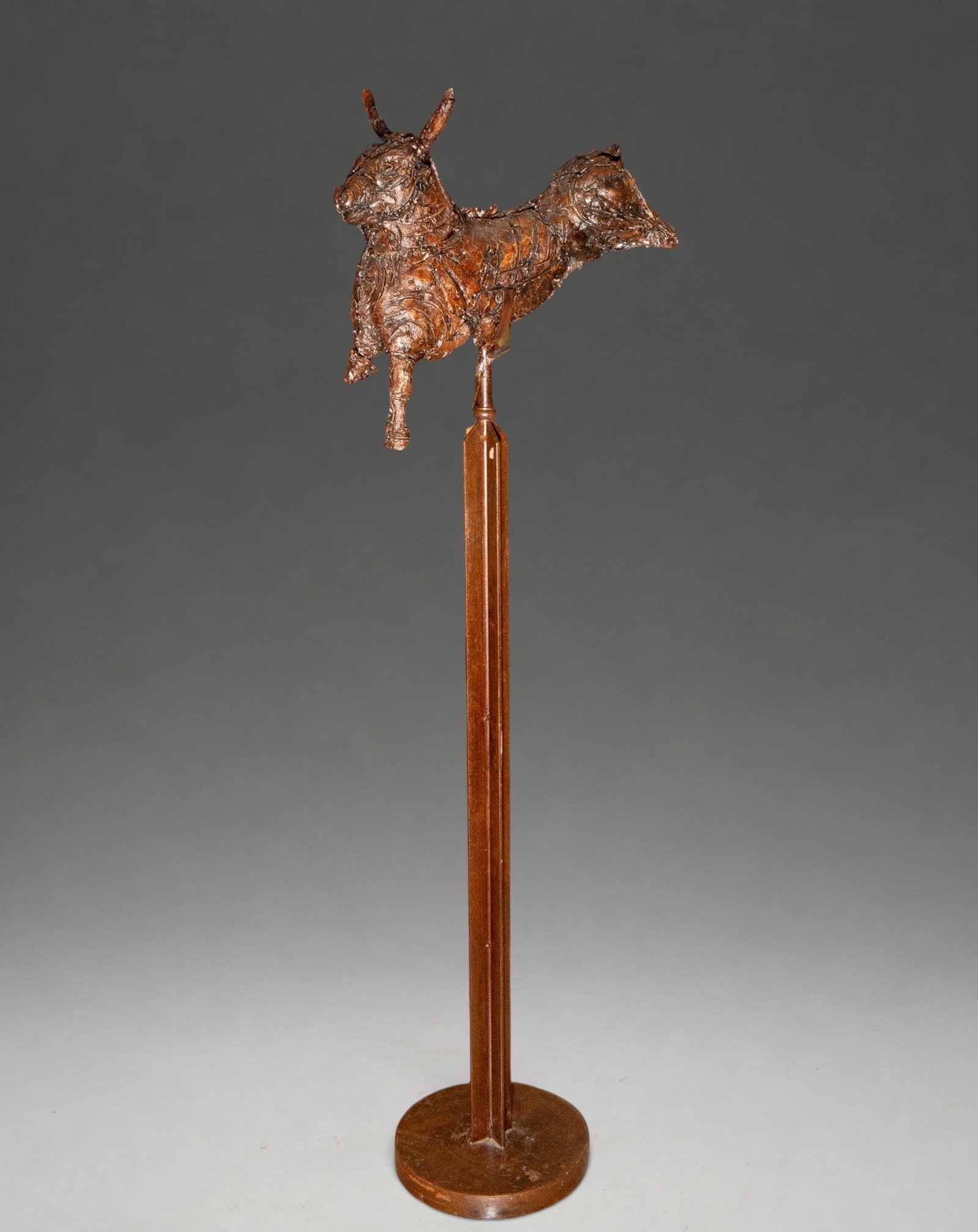Large Cretan bull, signed “F. Seguí?? – late 20th century-early 21st century: Contemporary sculpture depicting a Cretan bull, crafted from a combination of wood, iron, and epoxy resin. The figure features a distinctly textural construction, with fragmented and textured surfaces