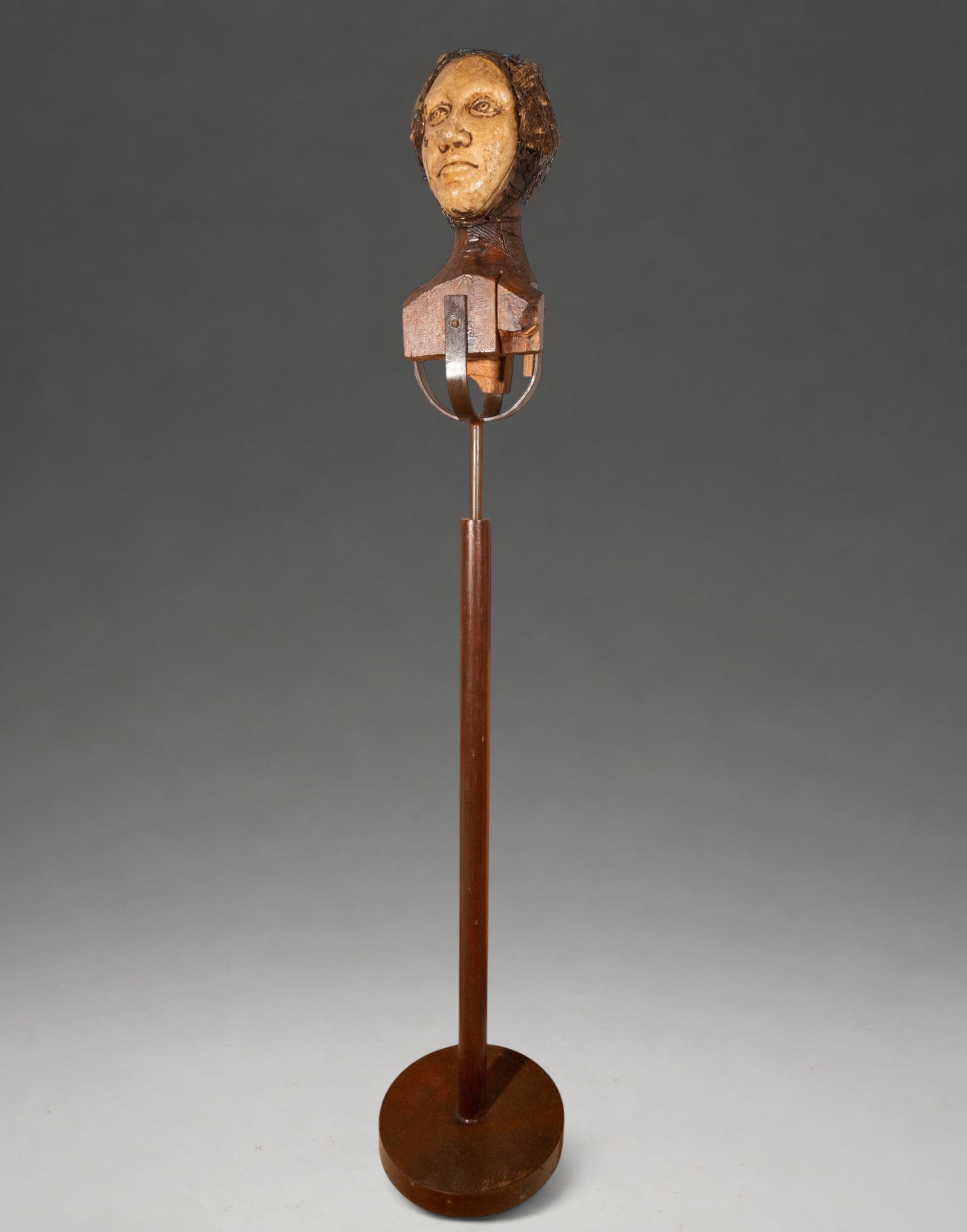 Nomadic Woman, signed “F. Seguí?? – Spanish School – late 20th-early 21st century: Contemporary sculpture representing a female bust, made using a combination of wood, wire, and metal elements. The face, with its expressive modeling and light surface, is integrated into a carved and