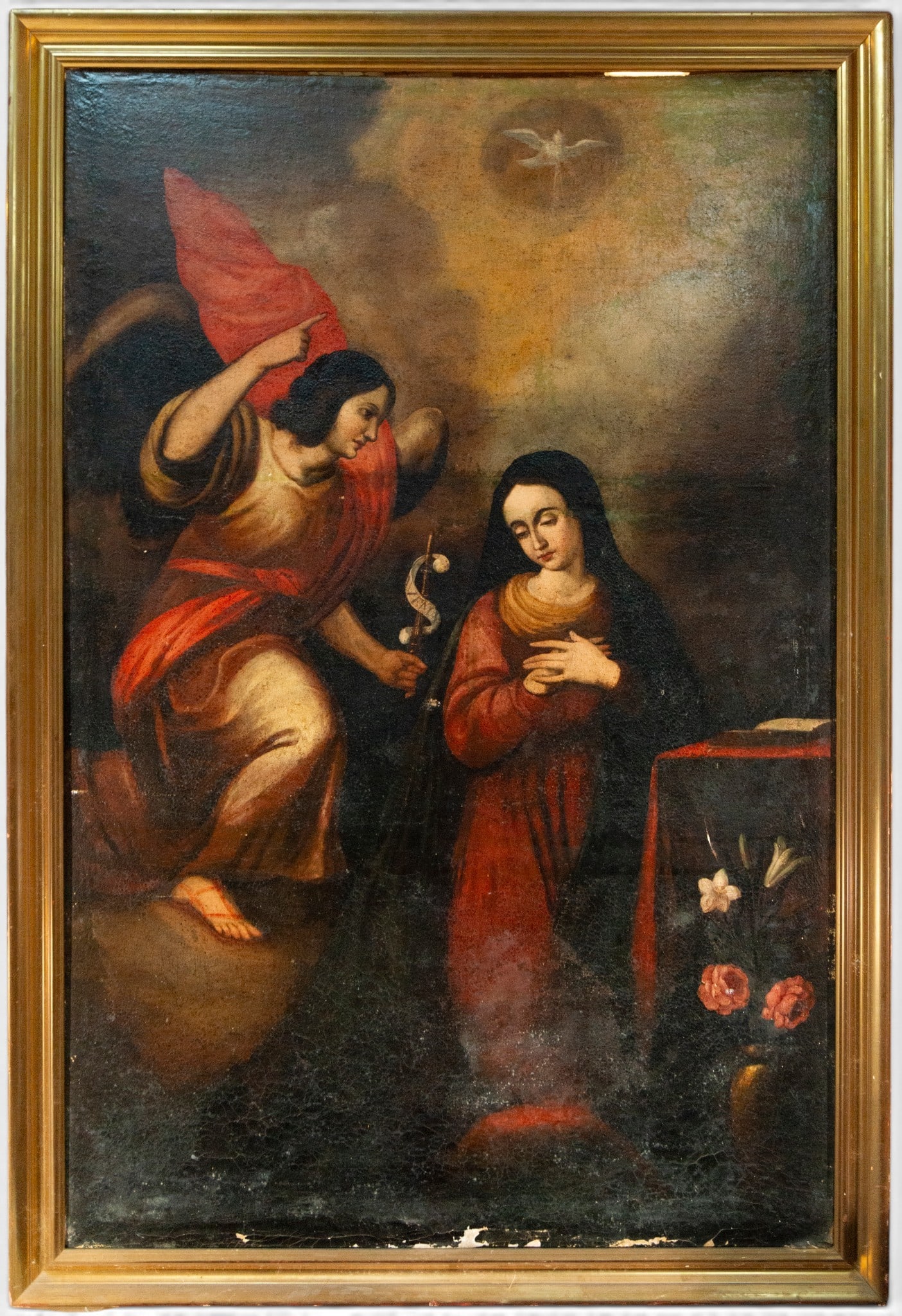 The Annunciation – Spanish School – 17th Century: Oil on canvas. Depiction of the Annunciation with the Archangel Gabriel on the left, holding a staff of lilies and pointing upwards, and the Virgin Mary kneeling on the right next to a prie-dieu with 