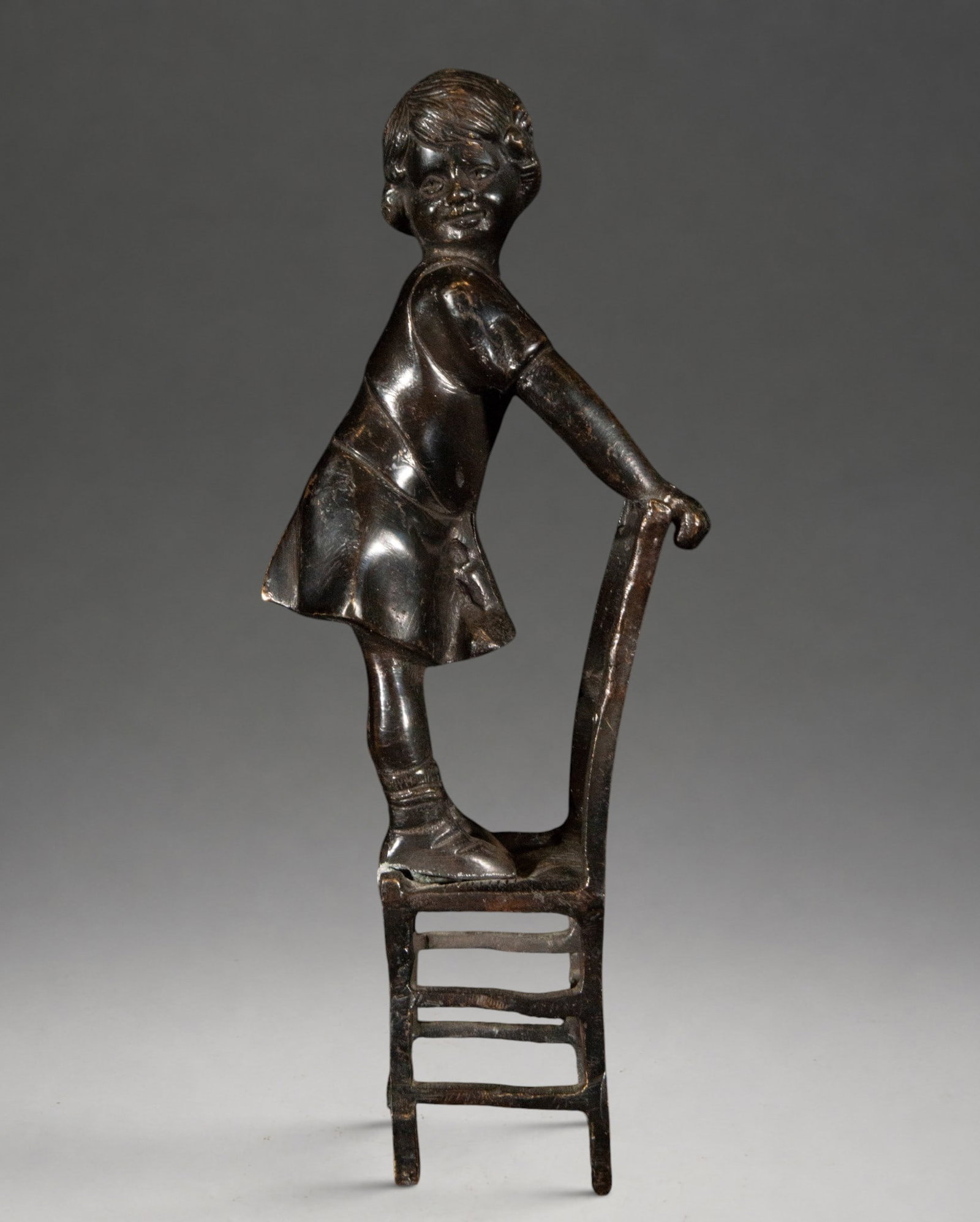 Child figure on a chair – 20th century (1 of 4)