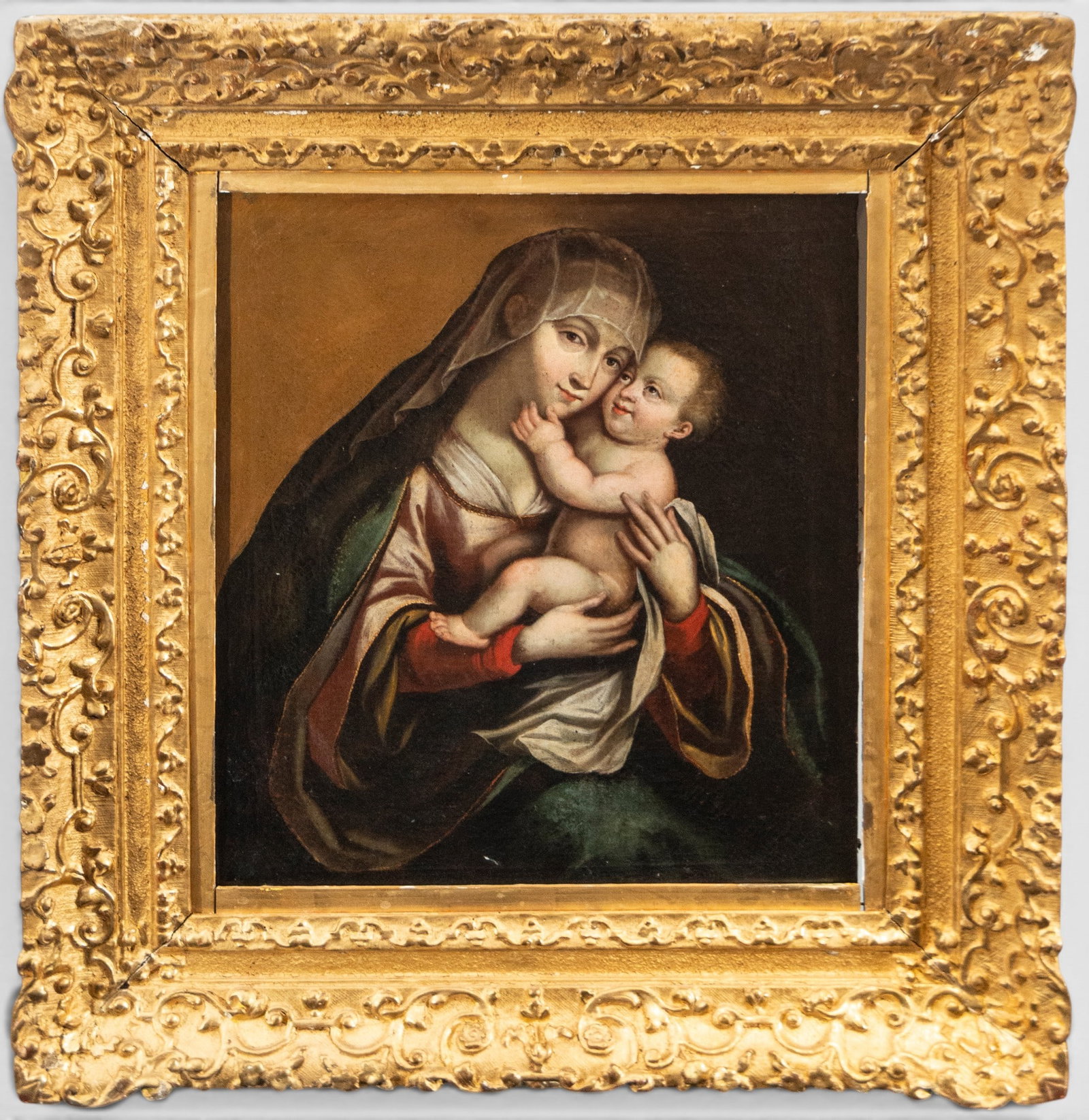 Beautiful Virgin and Child from the 17th Century - Master Italo Lombardo of the 17th Century: 17th-century Italian School - Oil on canvas. Dimensions: 52 × 44 cm; with frame: 72 × 67 cm. The Virgin is depicted half-length, holding the naked Christ Child, who affectionately approaches her fac