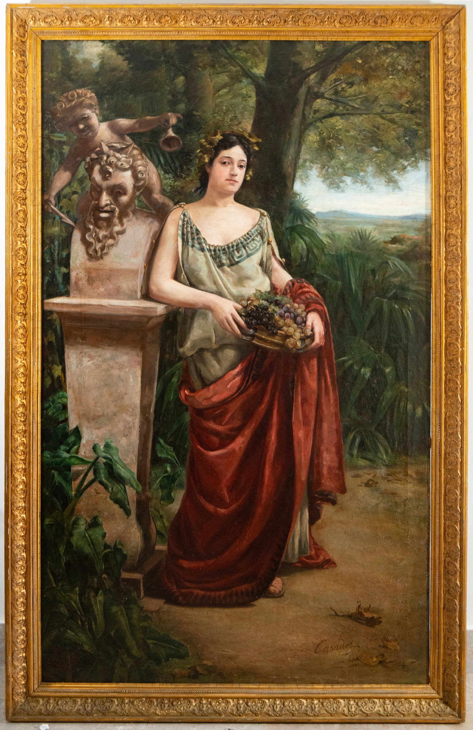 LARGE GODDESS CERES, ATTRIBUTED TO CASADO DEL ALISAL, 19TH CENTURY, signed “Casado?? and dated: Oil on canvas. Full-length female figure, dressed in a classically inspired tunic and a flowing red cloak, holding a fountain overflowing with bunches of grapes. To her left is a sculptural fountain w