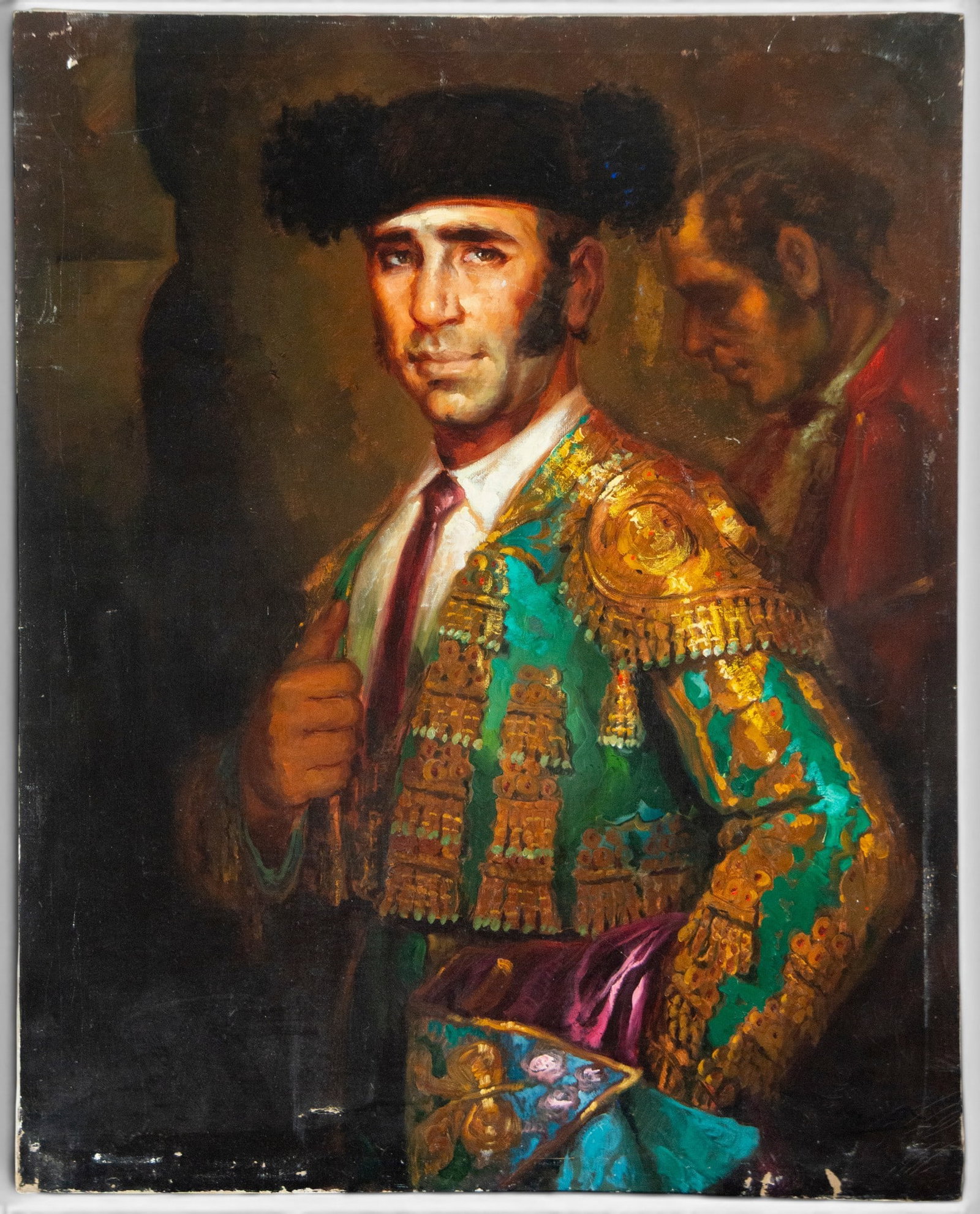 Portrait of a bullfighter, illegible signature – Spanish School – 19th century: Oil on canvas depicting a bullfighter, half-length, dressed in a green and gold bullfighting suit and a black montera, holding the muleta in the foreground. A second male figure appears in shadow in t