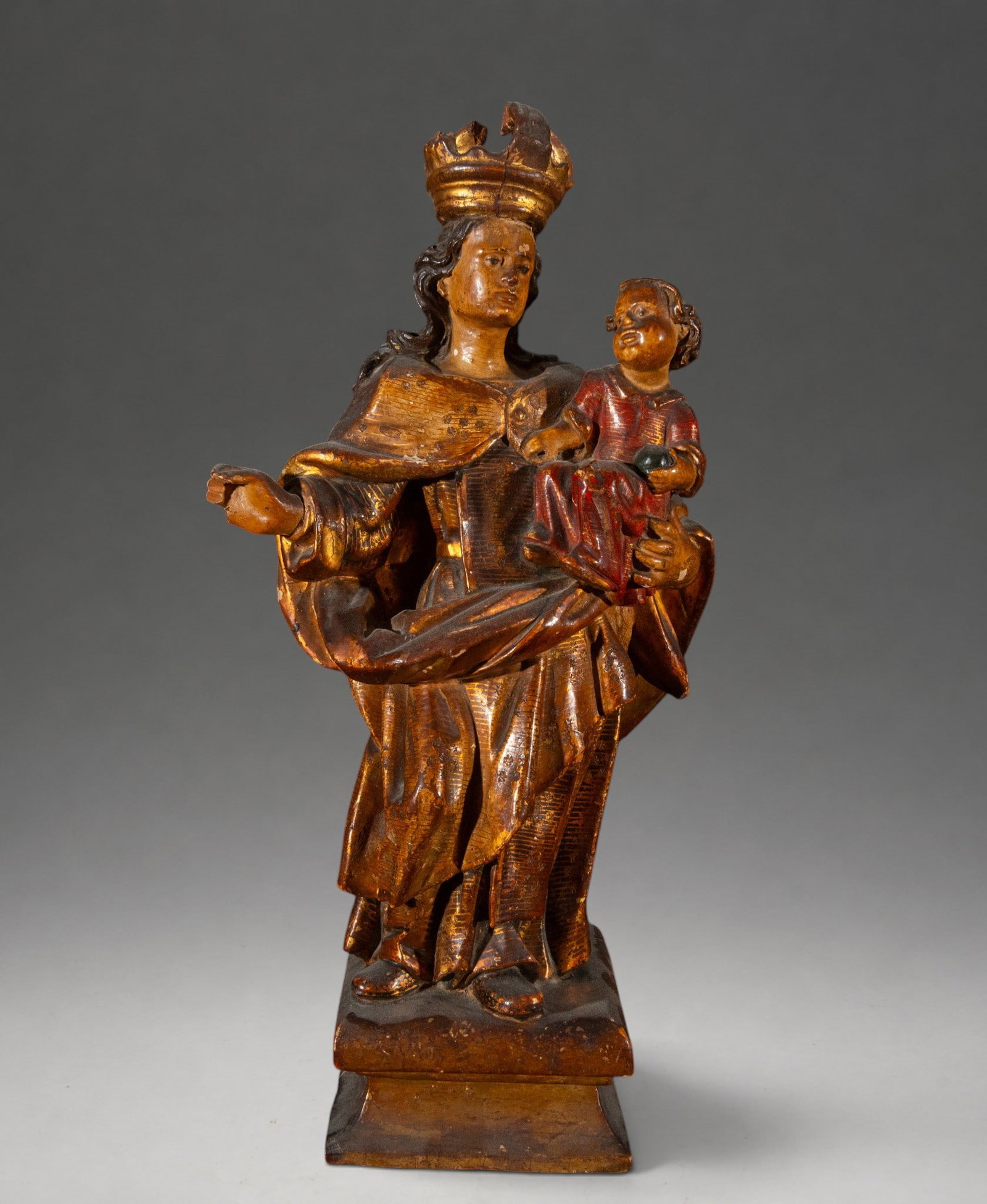 Beautiful Catalan Baroque Virgin from the 17th-18th century: Carved, polychromed, and gilded wooden sculpture depicting the crowned Virgin Mary holding the Christ Child on her left arm. The Virgin's right hand is extended in a gesture of presentation or blessin