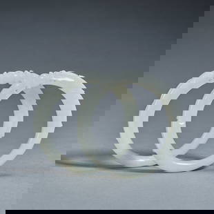 A pair of white jade 'dragon' bangles,Qing dynasty,inner diameter 6cm: A pair of white jade 'dragon' bangles,Qing dynasty,inner diameter 6cm ,total weight 90g .For size details please refer to the marks on our pictures.