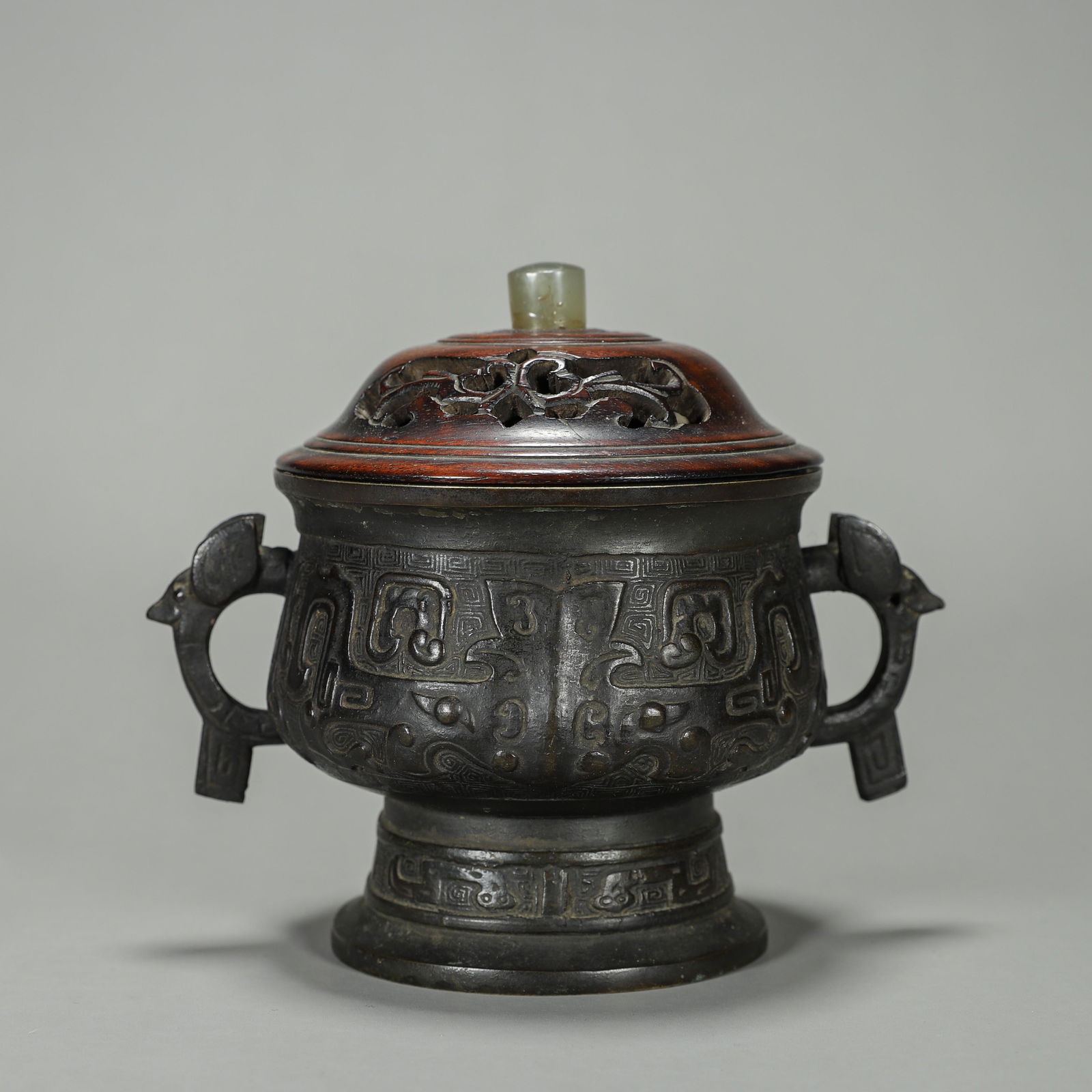 A taotie patterned copper pot with jade-inlaid wood lid (1 of 9)