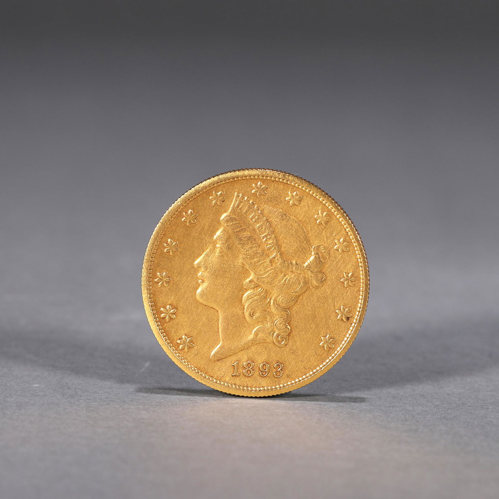 A figure patterned gold coin (1 of 8)