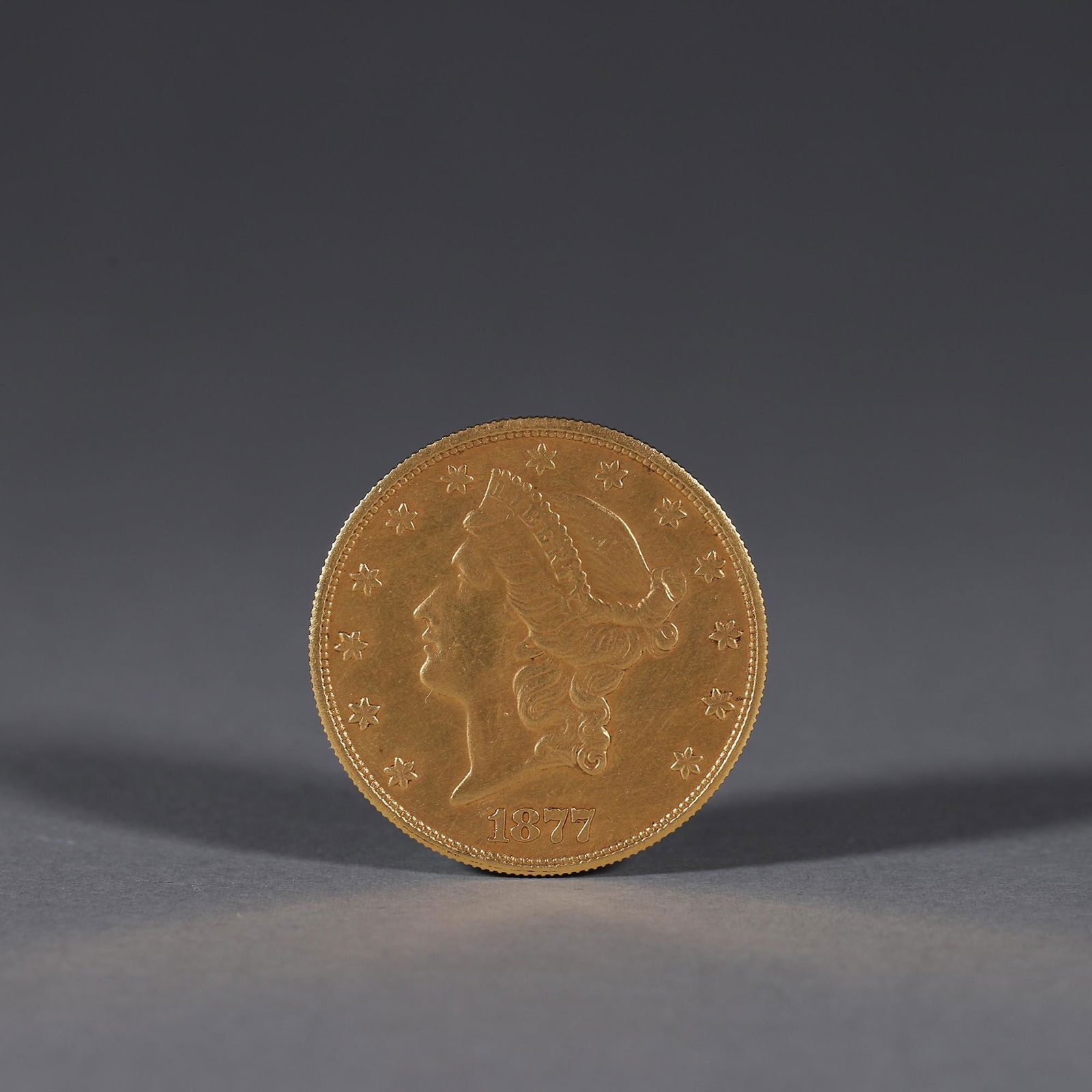 A figure patterned gold coin (1 of 7)