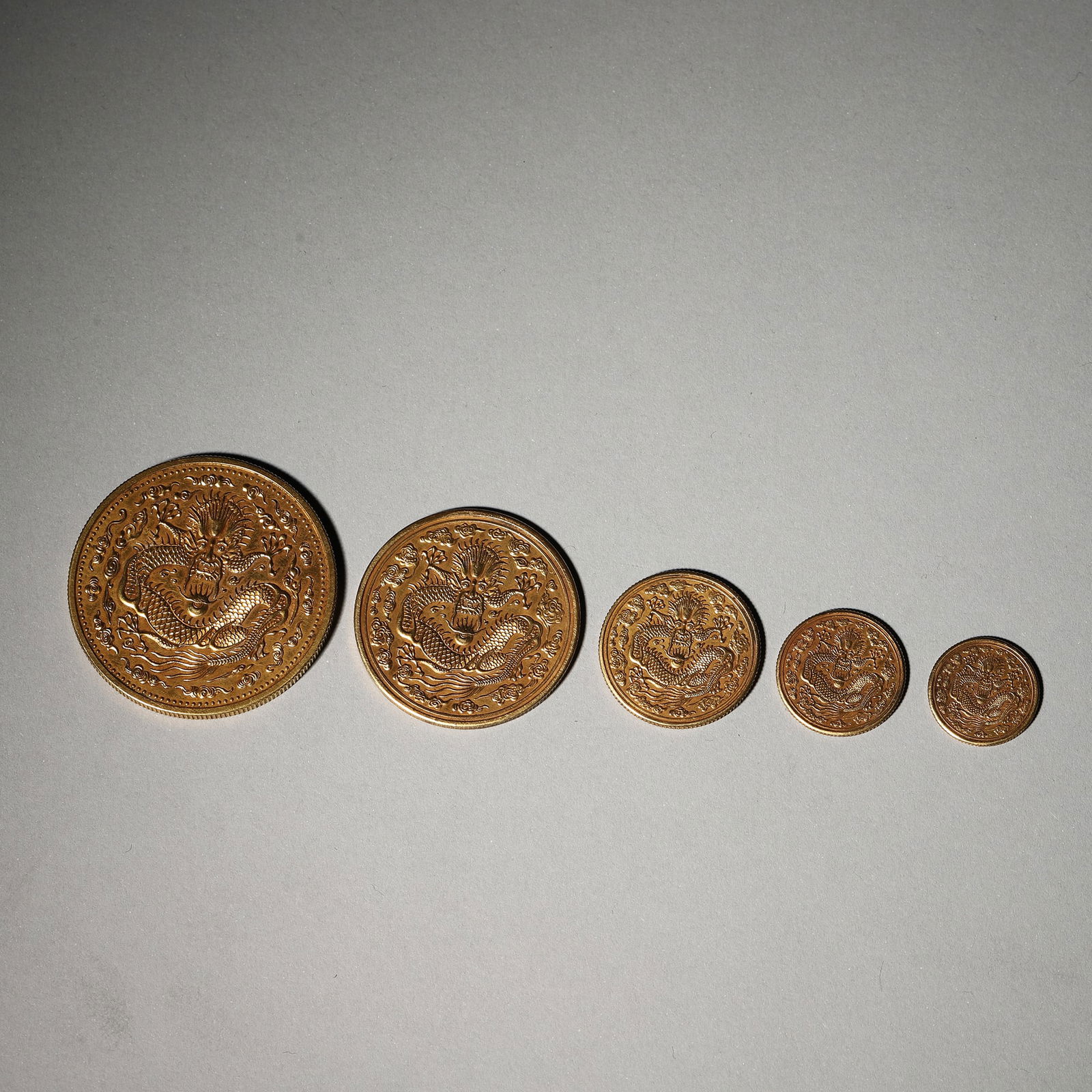A group of dragon patterned gold coins,Qing Dynasty,China (1 of 7)