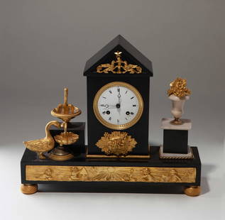 Swiss black marble-inlaid gilt-bronze mantel clock, 1810: Dimensions: 38 × 10 × 32cm (height)Description: This Napoleon Empire-style mantel clock features a precious marble body with gilt bronze decorations, boasting a classic and elegant design with exqui