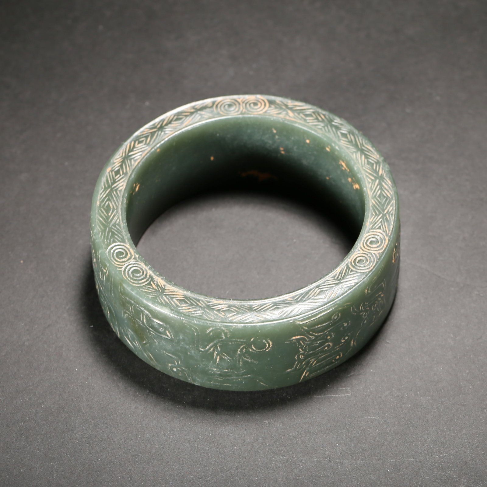 Warring States: Jasper Bracelet: Inner Diameter: 59.2mm (Inner Diameter: 2.33"); Weight: 146.5g (Weight: 0.32 lbs)This Warring States noble jade armlet (Hetian jade material) features "thread-carved" dragon-scale patterns and geometr