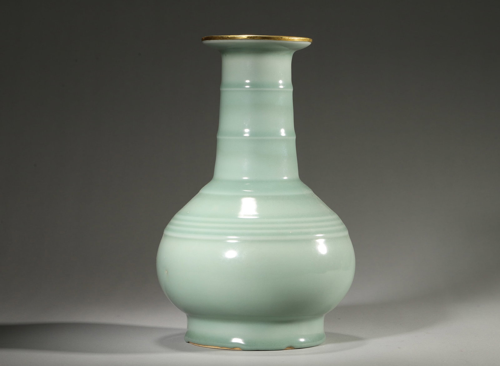 Southern Song Longquan Kiln Powder Celadon Glazed Ribbed Vase (Silver-Gilt Mounted Rim): D: 16.0cm (6.3"); Height: 26.0cm (10.24")A Southern Song Longquan treasure: fat-like powder celadon glaze, ribbed form echoing bronze ritual wares, silver-gilt rim (reflecting Song imperial ceramic st