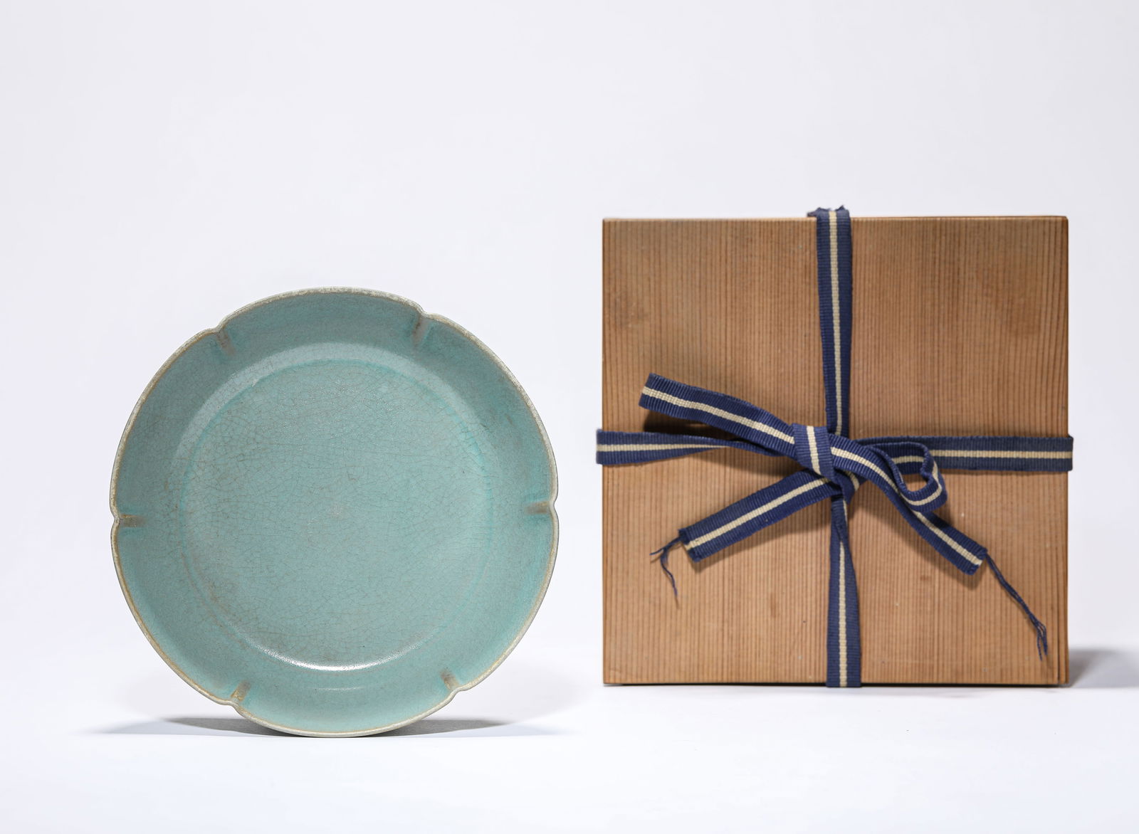 A Longquan celadon dish: Dimensions: Width: 14.3 cm (5.6 in.), Height: 3.6 cm (1.4 in.). All measurements are approximate.