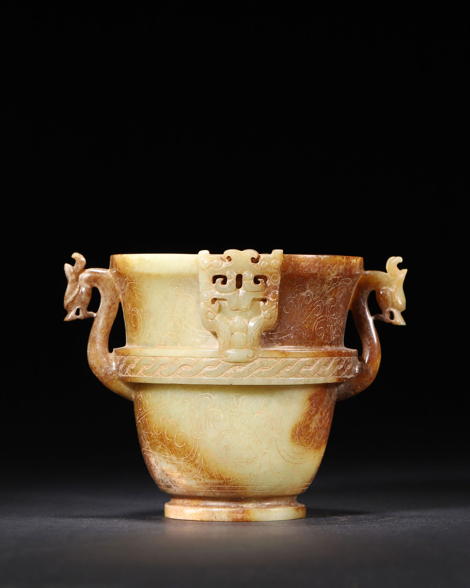 Han dynasty, a rare yellow jade cup with dragon handles and incised immortal motifs (1 of 8)