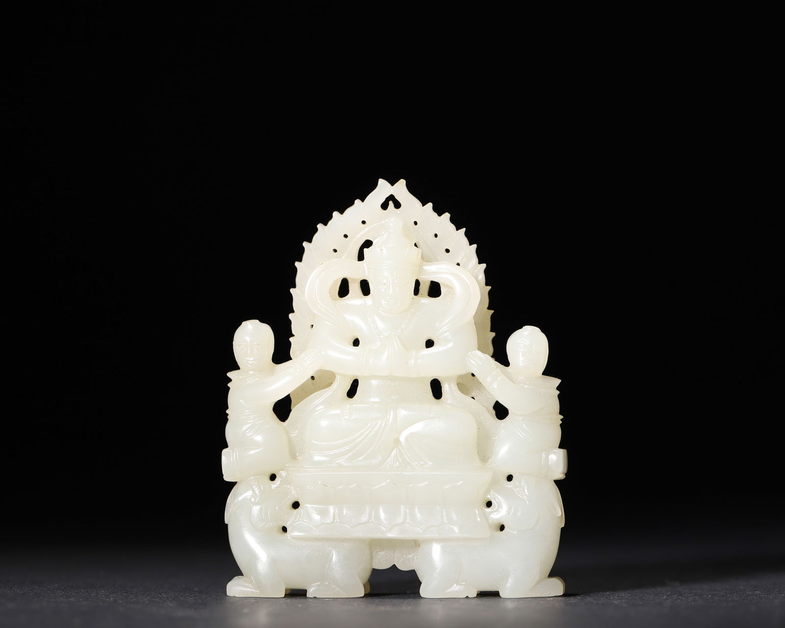 A white hetian jade tibetan buddhist bodhisattva statue, ming dynasty: This statue, a masterpiece of ming dynasty jade carving, is made of white hetian jade, depicting a tibetan buddhist bodhisattva, attendants and a double-lion base with openwork flame halo. Exquisitely