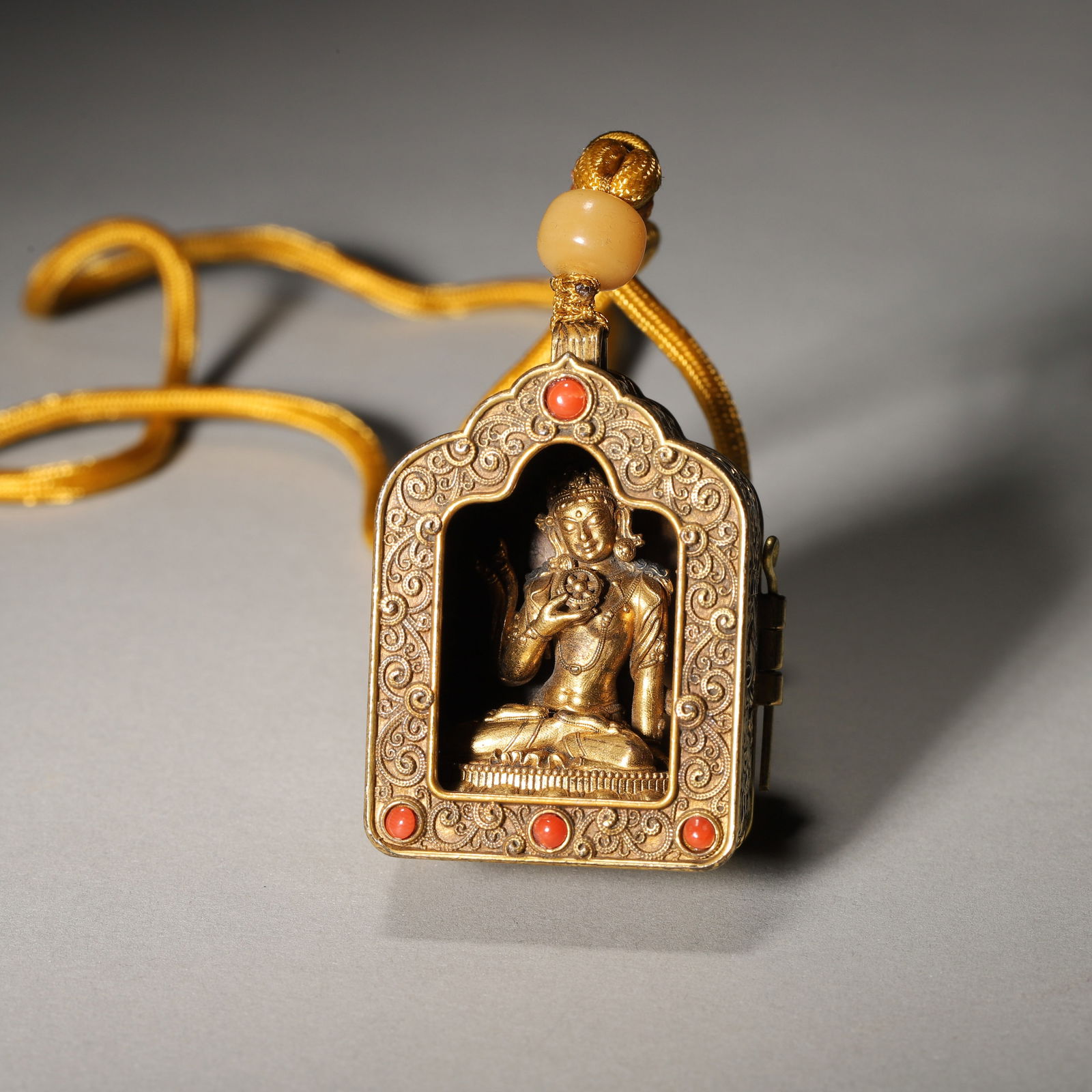 Mid-qing dynasty, gilt bronze & red agate-inlaid gau pendant with guanyin (1 of 5)