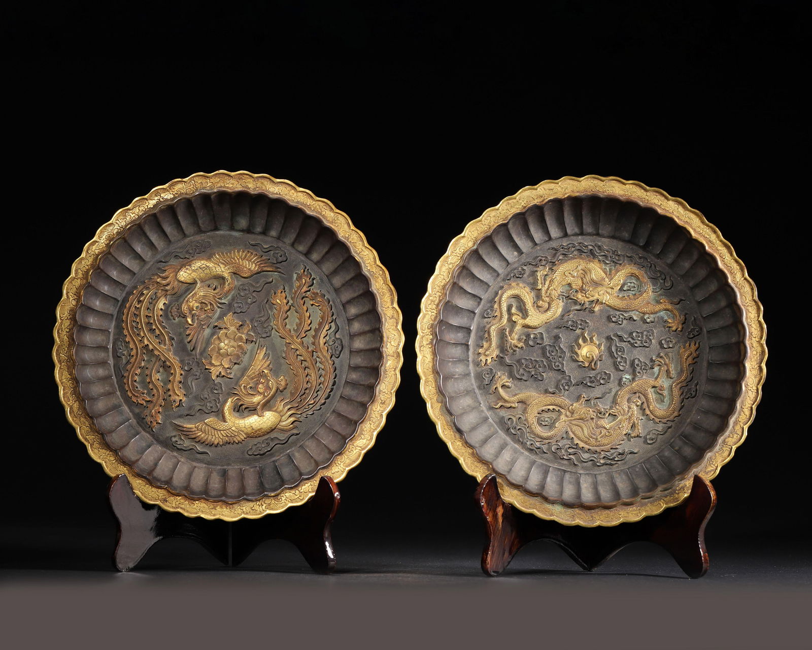 Qing dynasty, qianlong period, a pair of gilt-bronze chrysanthemum-petal dishes with dragon and (1 of 10)