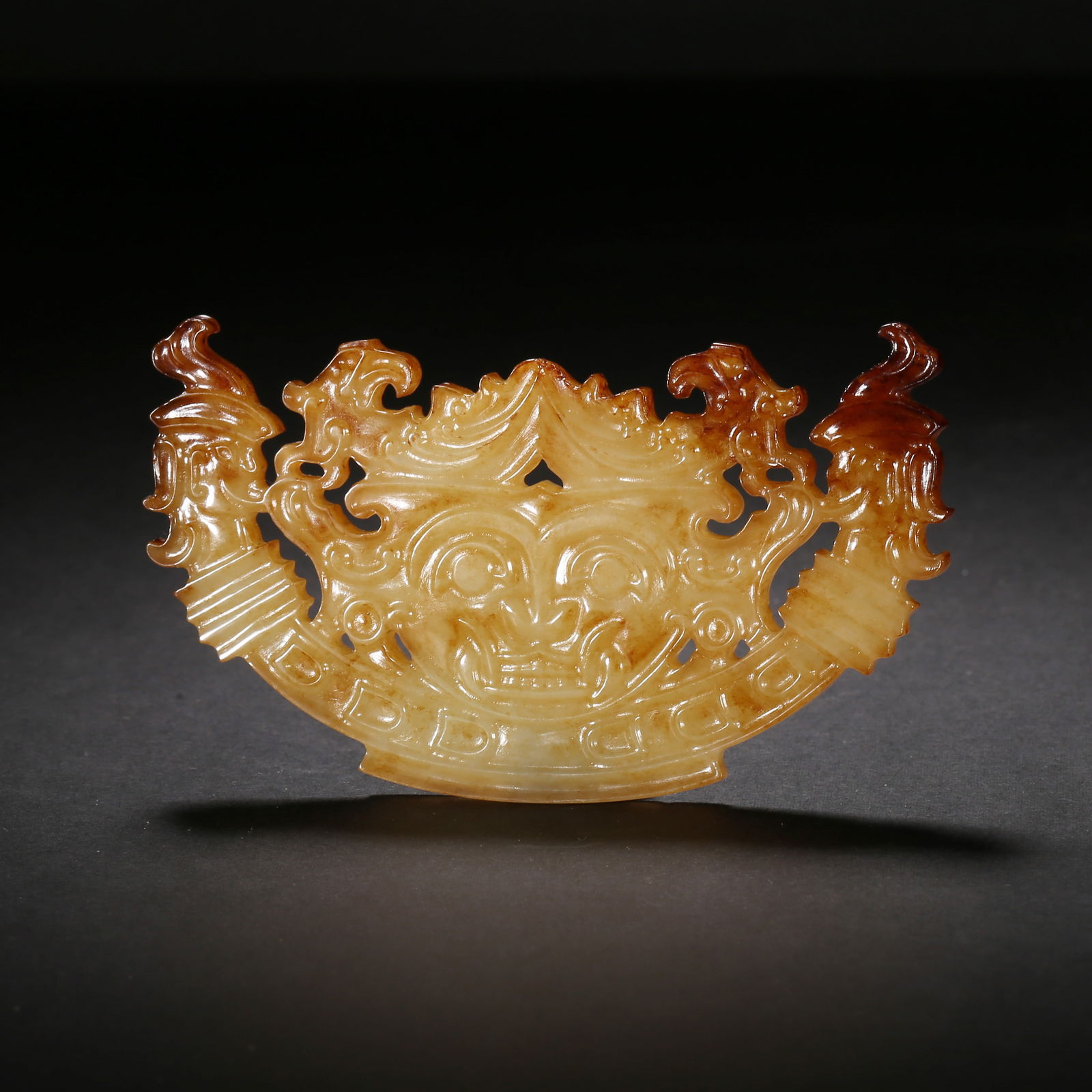 Warring states period, yellow hetian jade huang-form pendant with openwork beast-face, dragon and (1 of 2)