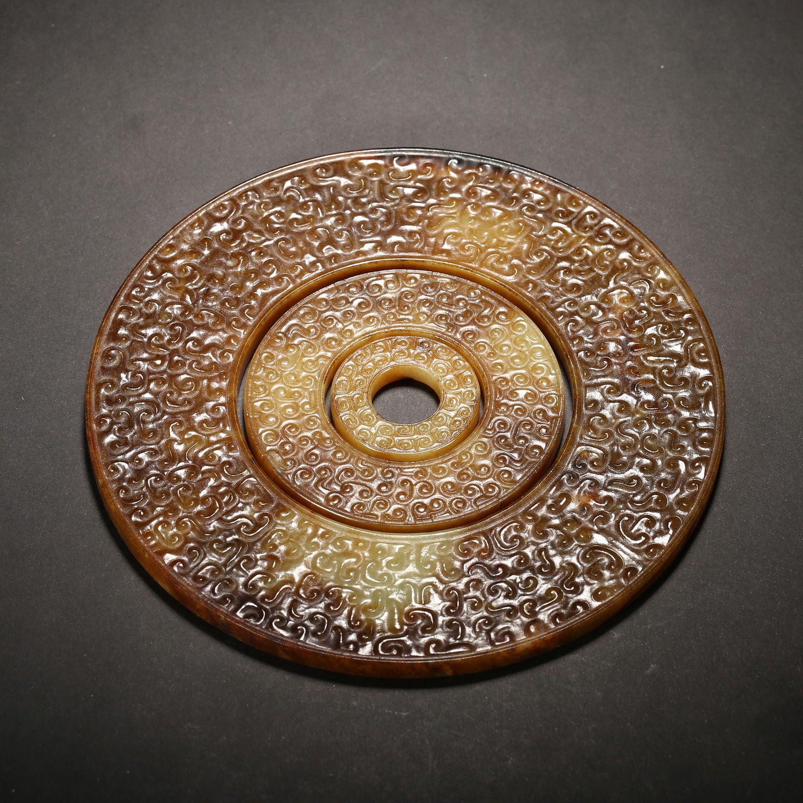 Warring states period, yellow hetian jade triple-ring bi with full grain pattern (1 of 2)