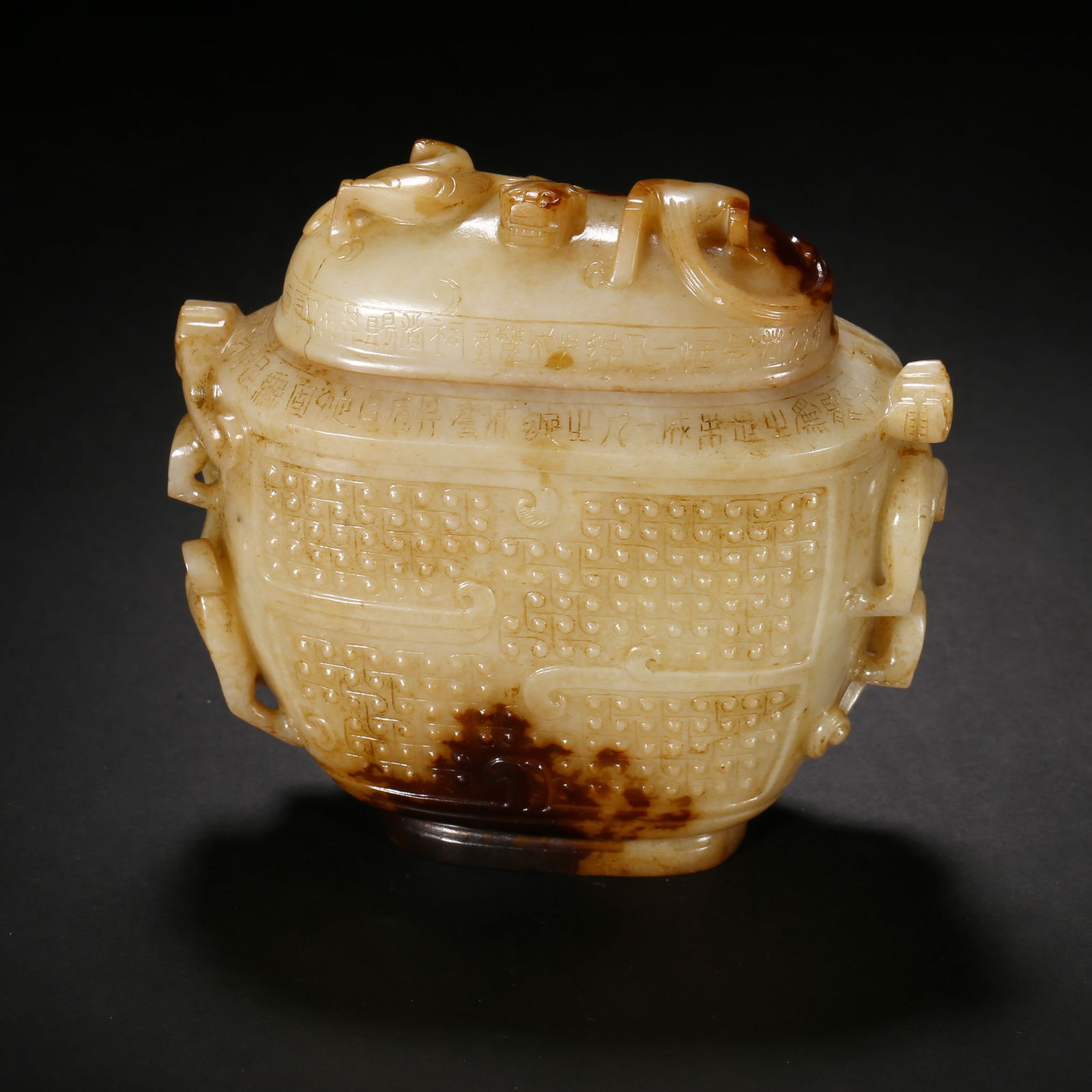 Han dynasty, white hetian jade lidded jar with chi-dragon finial, grain patterns and black patina (1 of 4)