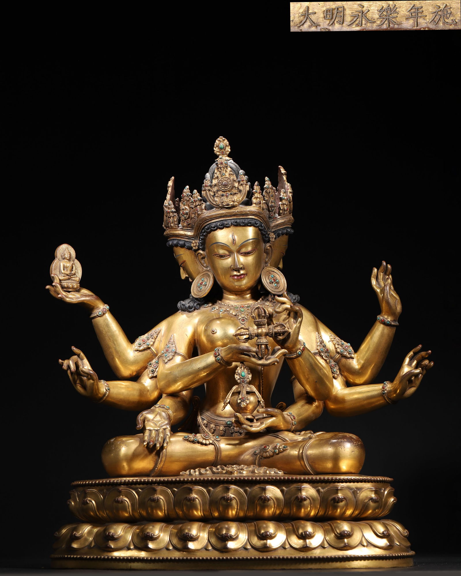 Yongle period, ming dynasty imperially gilt bronze seated ushnishavijaya (three-faced, eight-armed) (1 of 13)