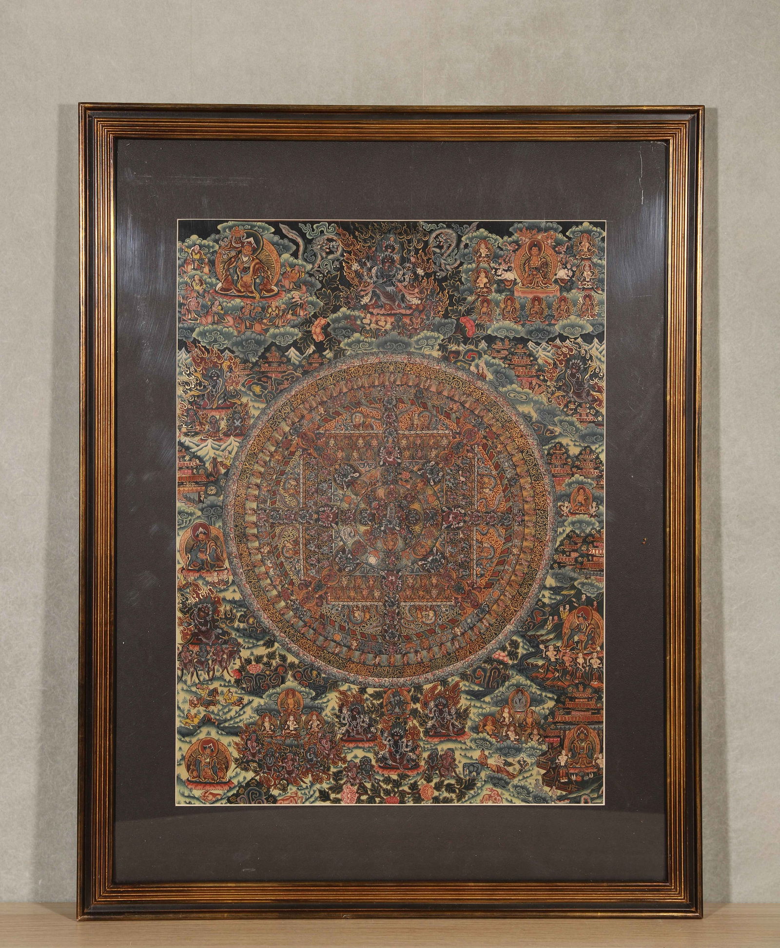 Mid-qing dynasty, black-ground mineral pigment thangka of kalachakra mandala: This mid-qing dynasty thangka depicts the kalachakra mandala on a black ground with mineral pigments, featuring an elaborate composition and exquisite craftsmanship. It is a masterpiece of tibetan