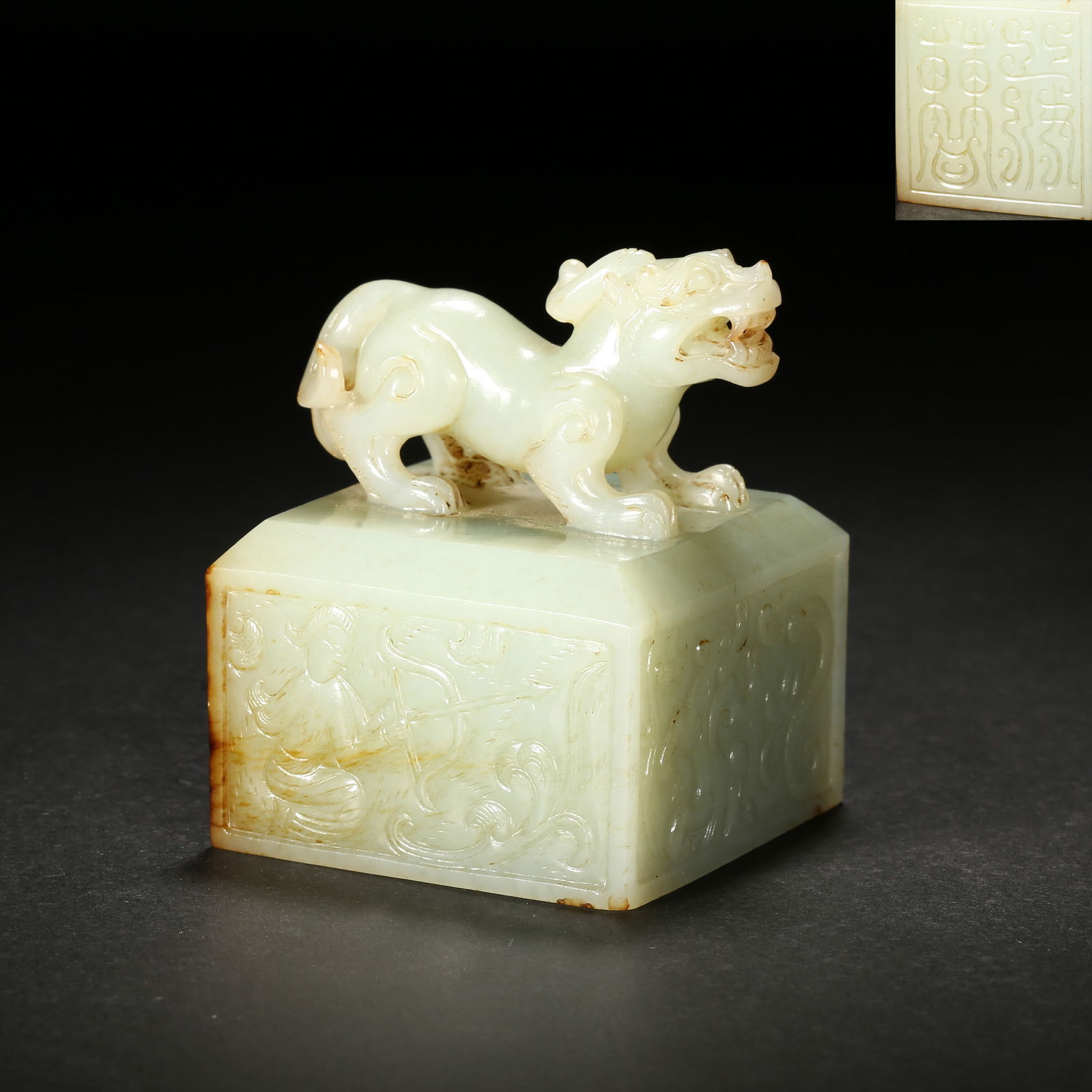 Han dynasty, white hetian jade seal with chi-tiger knob and bird-insect script: This white hetian jade seal from the han dynasty features a powerful high-relief chi-tiger knob, intricate bird-insect script on the face, and incised immortal-beast patterns on the sides, representin
