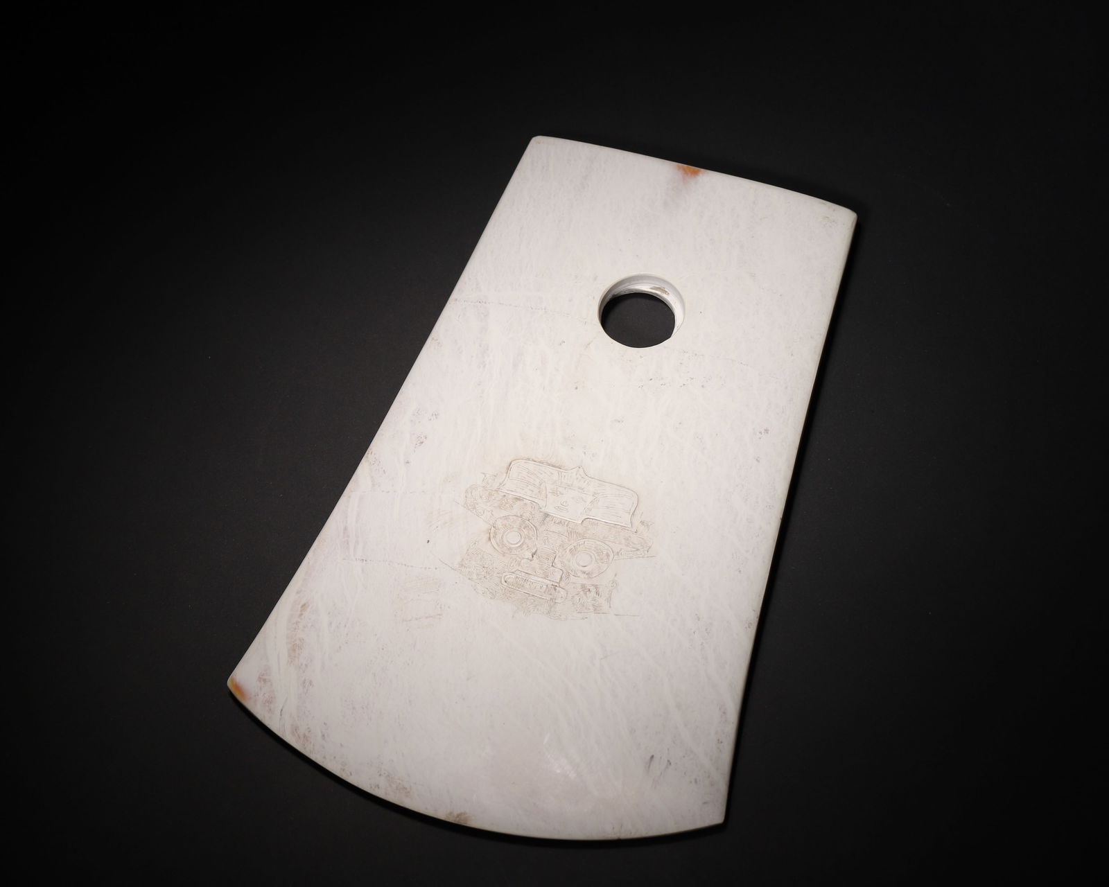 Liangzhu culture jade yue axe with human-animal mask motif: A core ritual artifact from the liangzhu culture (c. 3300–2300 Bce). The jade has developed a natural patina over millennia, presenting a bone-white color (calcification). The blade is shallowly car