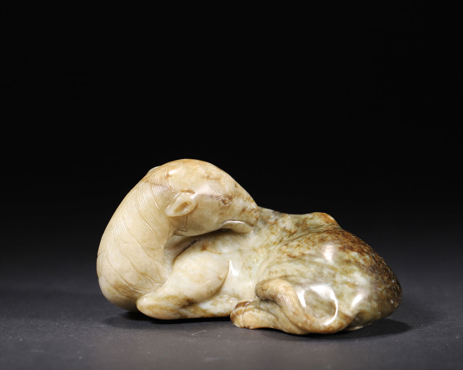 A hetian seed jade "recumbent horse" ornament with natural patina, qianlong period, qing dynasty (1 of 7)