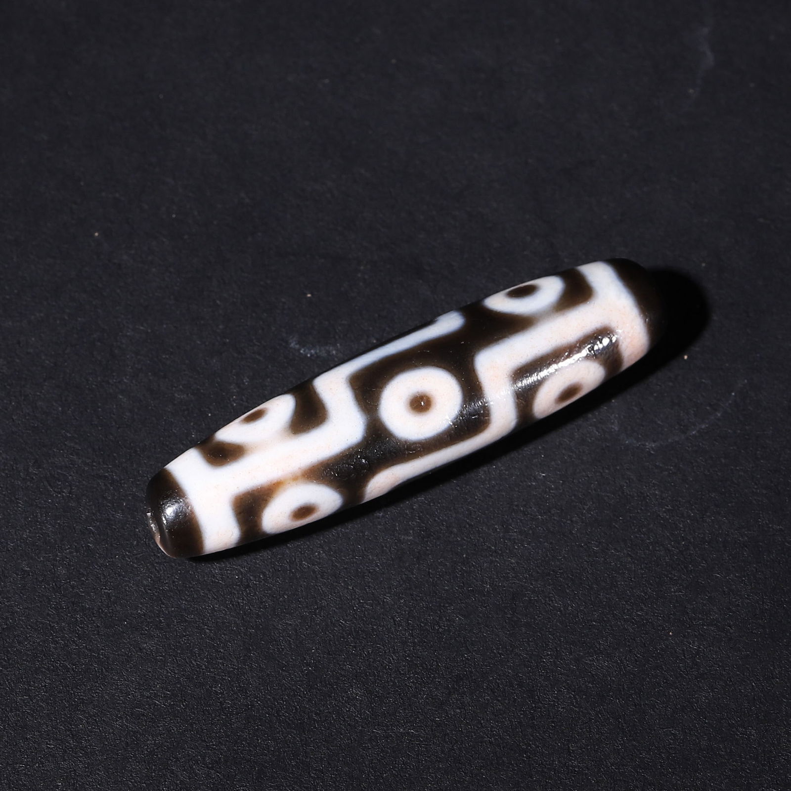 Tang dynasty, agate nine-eye old dzi bead with cinnabar speckles (1 of 10)