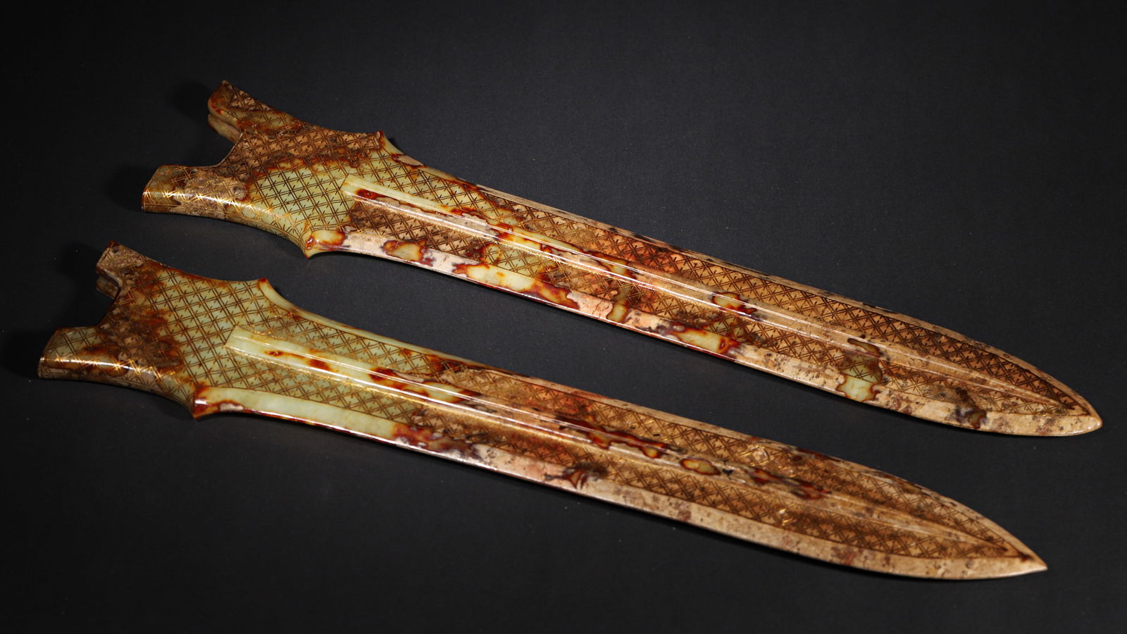 Han dynasty pair of archaic jade sword pommels with gilt geometric patterns (1 of 13)