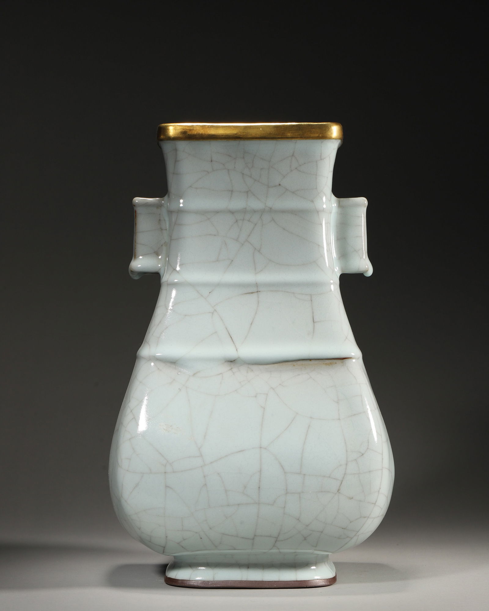 Southern song guan kiln celadon vase with loop handles: A southern song (1127-1279) guan kiln celadon vase: lustrous crackled glaze, neat form, elegant loop handles, and gilt rim. It embodies the “jade-like” beauty of southern song guan kiln, a pin