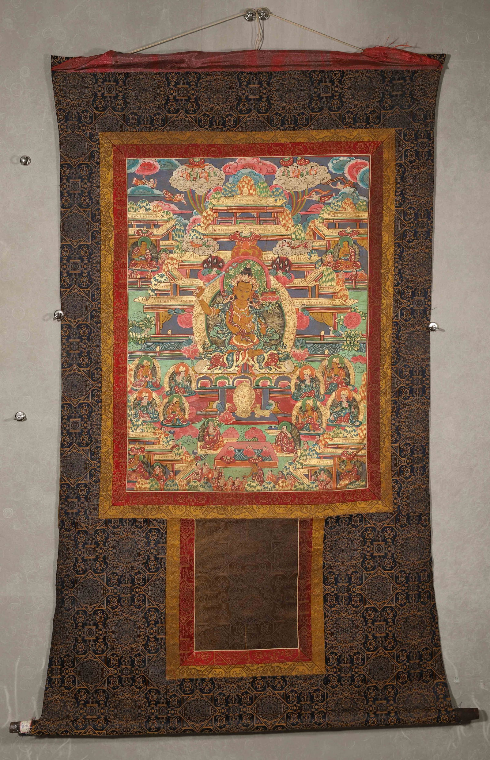 Mid-qing dynasty, mineral pigment thangka of samantabhadra bodhisattva: life story: This mid-qing dynasty thangka depicts the life story of samantabhadra bodhisattva with natural mineral pigments, featuring elaborate composition, rich colors, and elaborate mounting. The back has bles