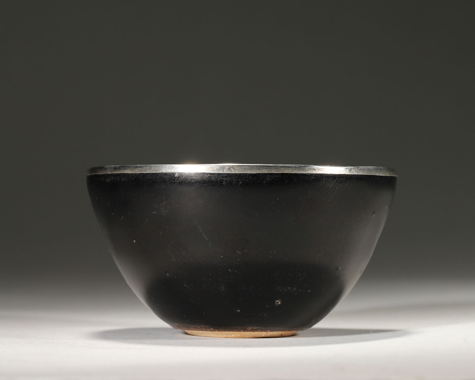 Song dynasty jizhou kiln black-glazed leaf-patterned bowl with silver mount (1 of 5)