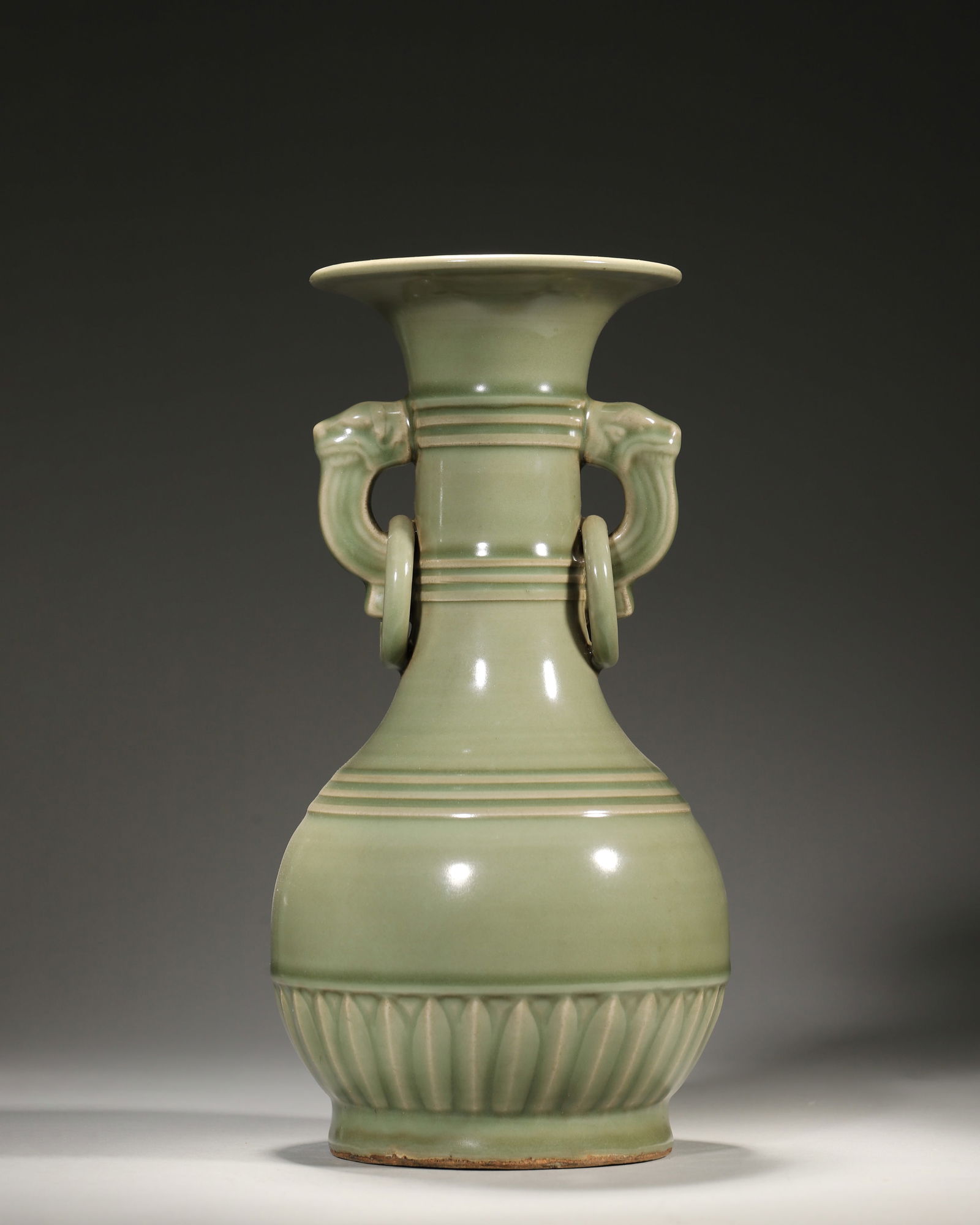 Song dynasty longquan kiln celadon vase with elephant-handle rings: A rare song longquan vase: jade-like celadon glaze, dynamic elephant-handle ring relief, elegant lotus patterns. Merging longquan's glaze beauty & carving craft—a rare relic of song celadon art & au