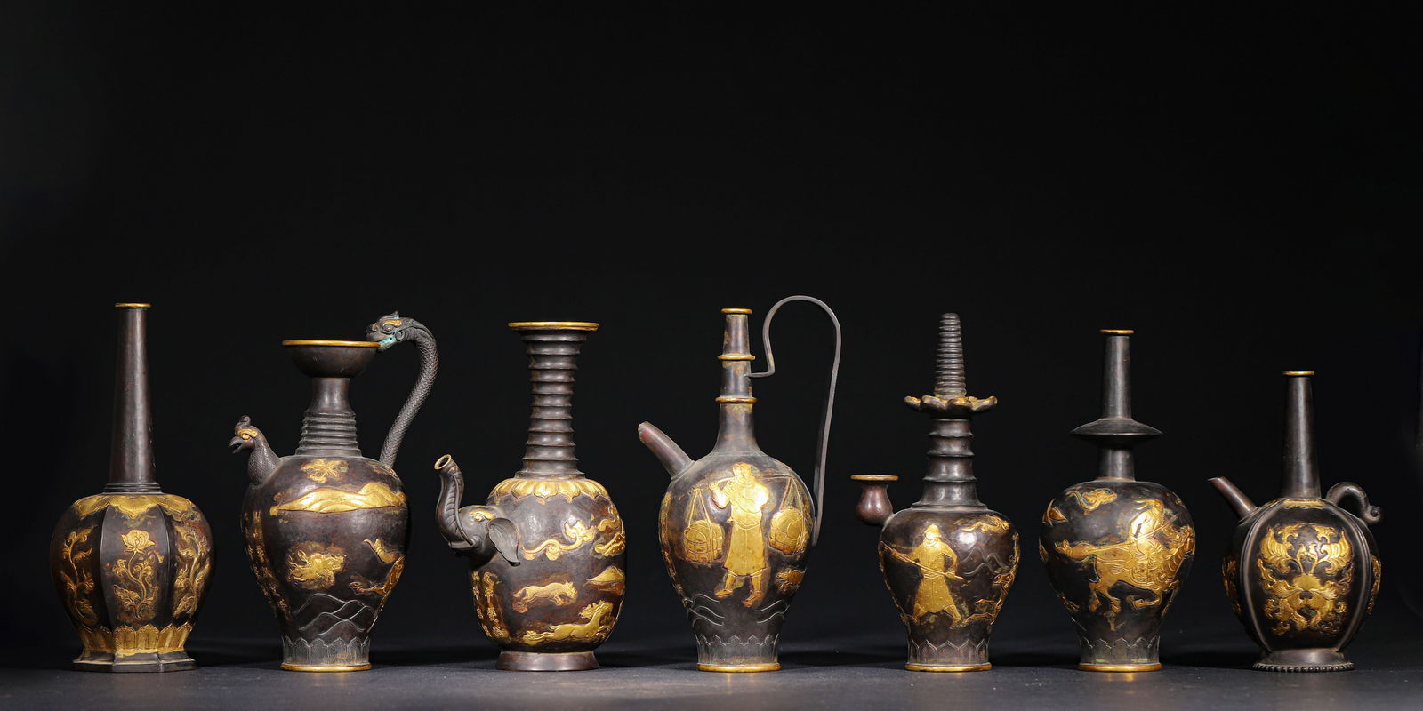 Tang dynasty, a set of seven gilt-bronze ewers and vases with figural and beast motifs (1 of 19)