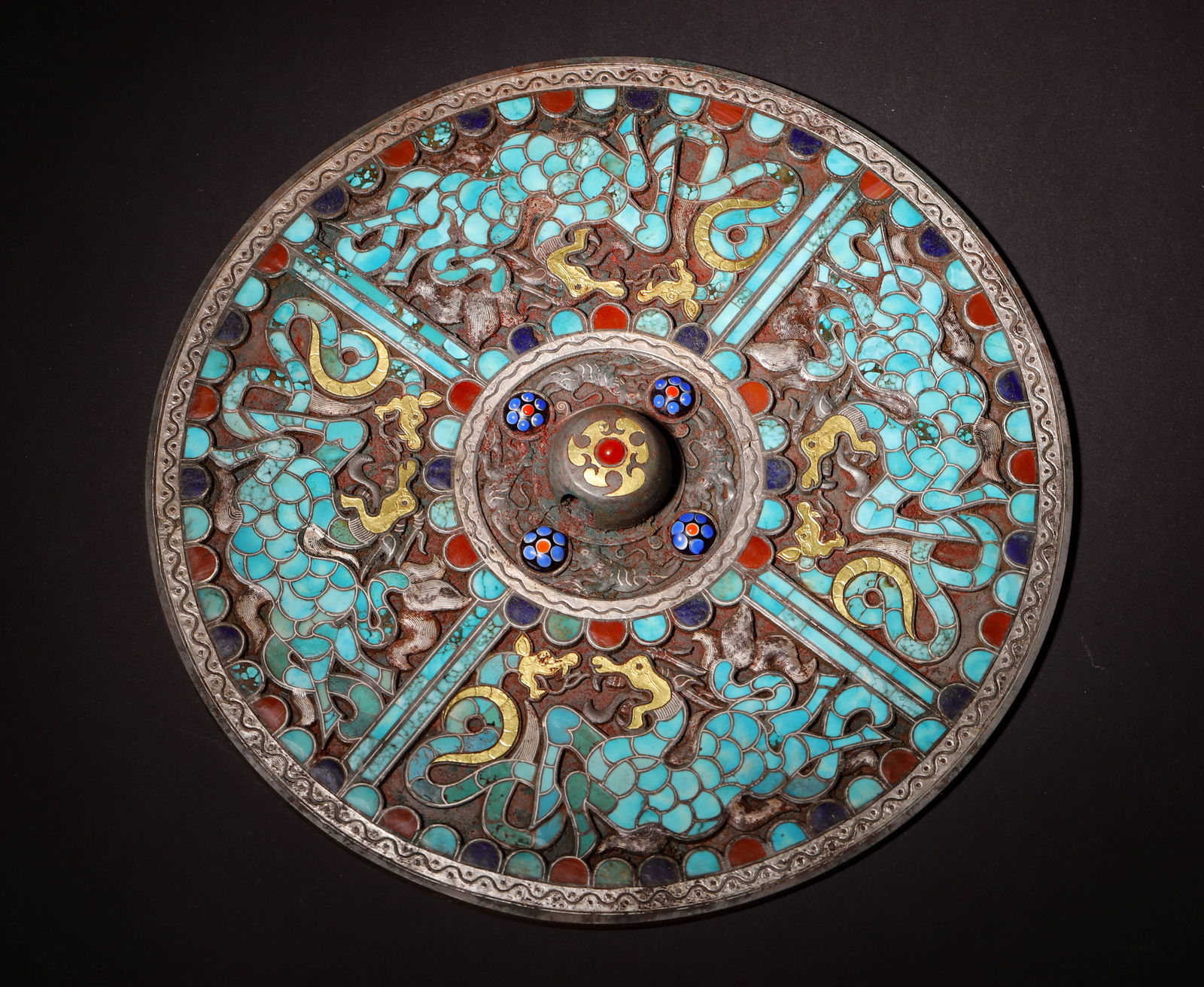 Han dynasty bronze mirror with gold-silver inlay & turquoise dragon motifs: A rare han bronze mirror: exquisite gold-silver inlay & turquoise, dynamic dragon motifs. Merging han bronze craft peak & decorative art—a rare han mirror relic, of great historical & artistic value