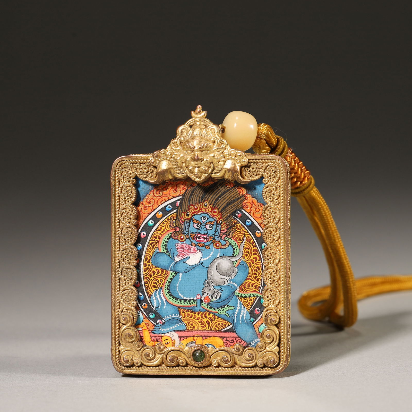 Qing dynasty, gilt silver wire-inlaid thangka gau pendant with black jambhala (1 of 5)