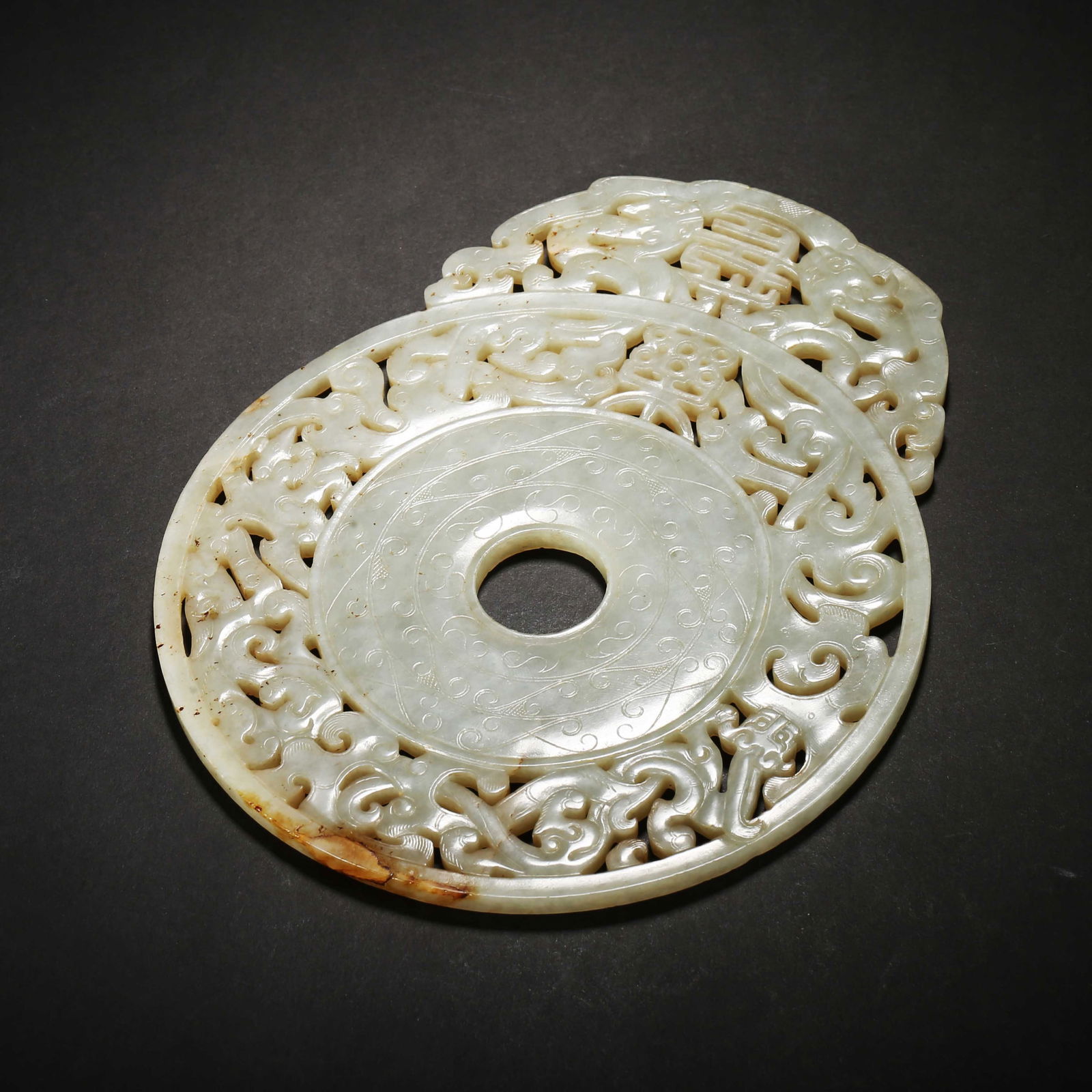 Han dynasty, white hetian jade openwork "changle" bi with protruding rim (1 of 4)