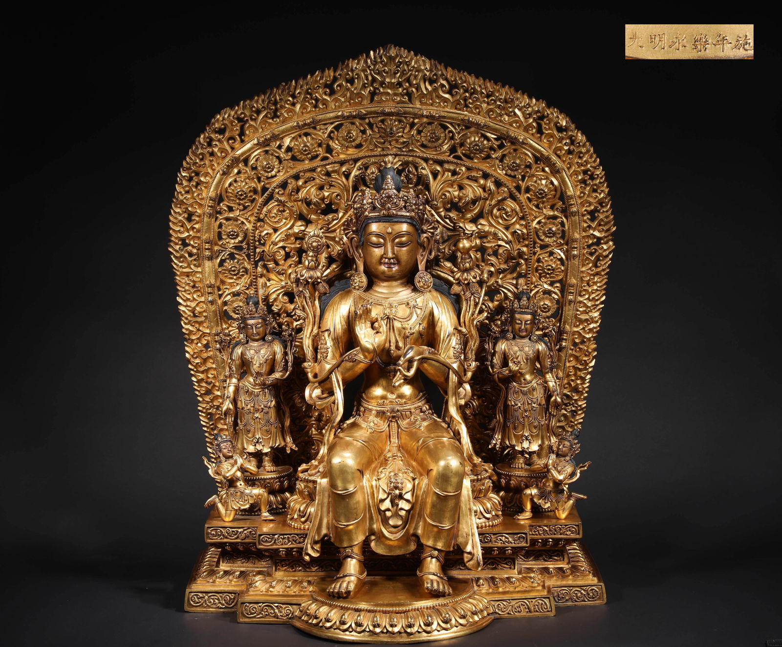MING DYNASTY, YONGLE BRONZE GILDED MAITREYA BUDDHA STATUE: H:77cmW:63cmWeight:55000g This is a three-figure gilded copper statue of Guanyin Bodhisattva from the Yongle period of the Ming Dynasty. The entire statue is cast in fine copper and gilded throughout.