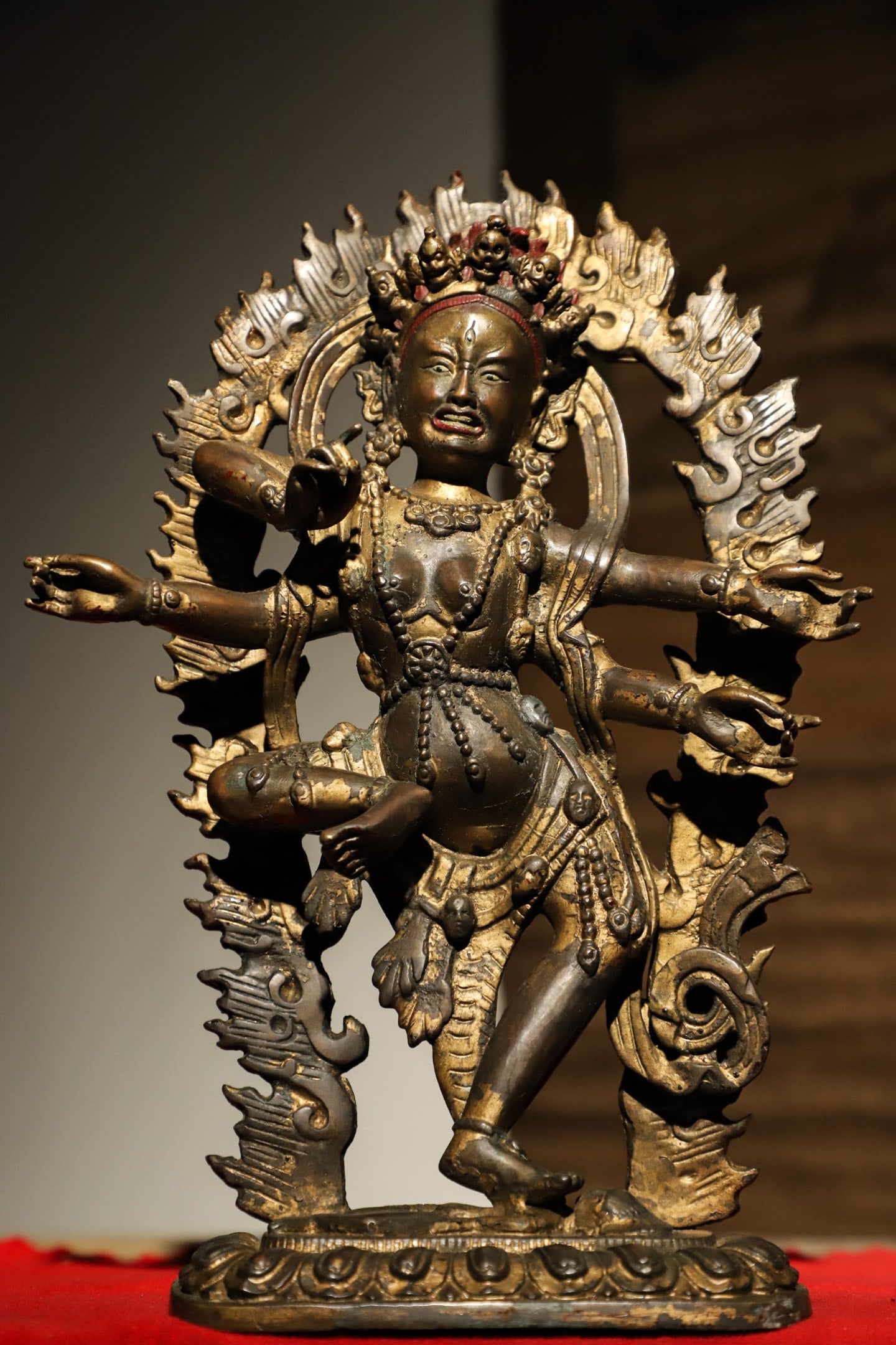 QING DYNASTY, BUDDHIST GILDED SIX-ARMED MAHAGALA STATUE: Weight:1923g.H:30cmL:22cmW:8cmThis is a Qing Dynasty Tibetan Buddhist gilded six-armed Mahakala statue, a protective deity in Tibetan Buddhism. Crafted from gilded copper, it depicts the wrathful form