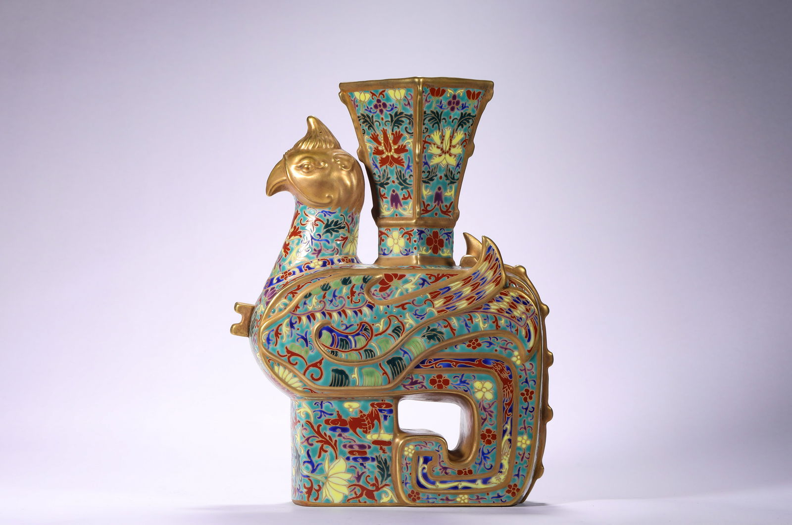 QING DYNASTY QIANLONG ENAMEL PHOENIX AND BIRD VASE: H:25cmW:17.5cm This is a pink painted golden phoenix head flat pot from the Qianlong period of the Qing Dynasty, which is a typical antique display porcelain in the palace.